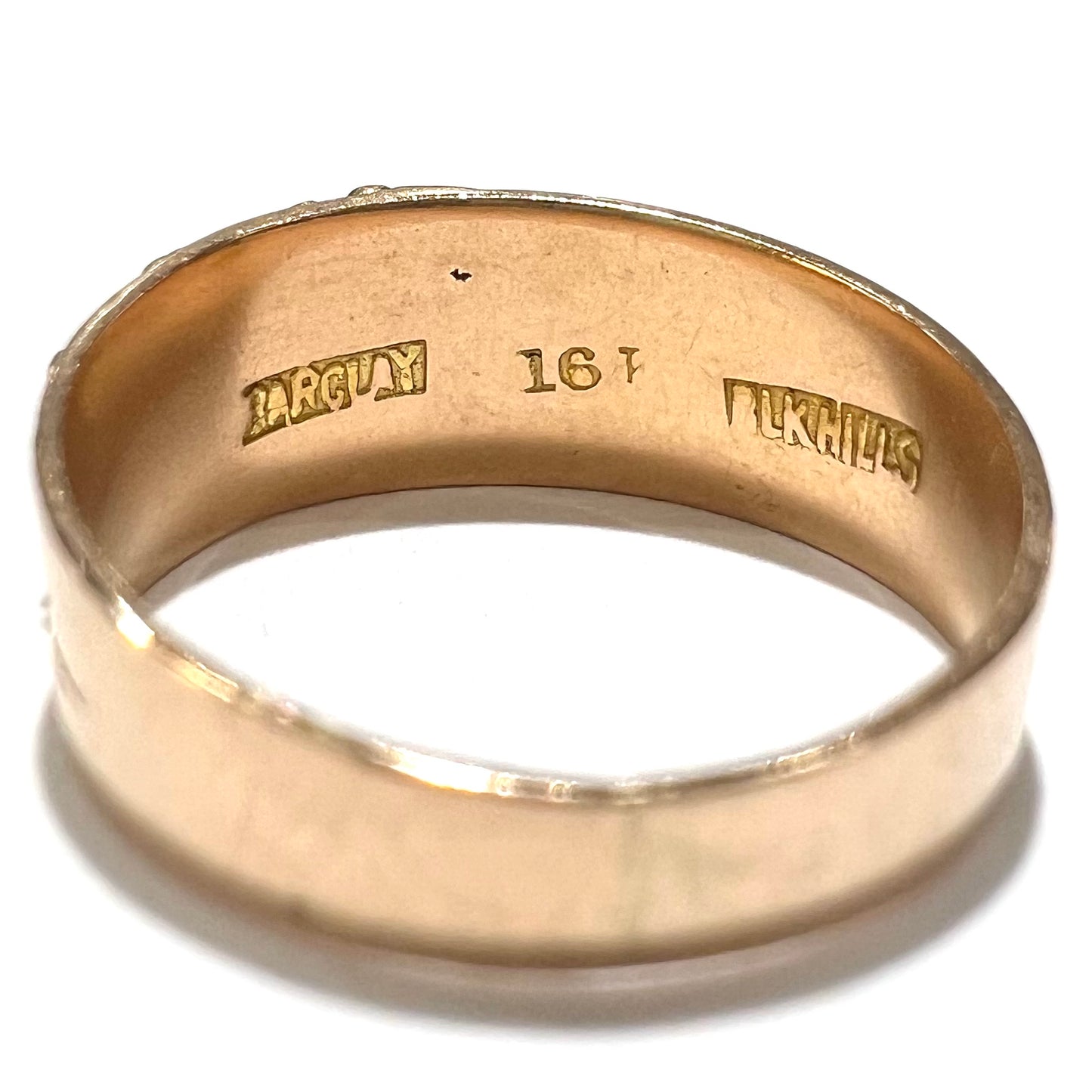 A ladies' two-tone Black Hills gold ring featuring the motif of leaves. The inside of the ring is stamped "16K" and "BARCLAY".