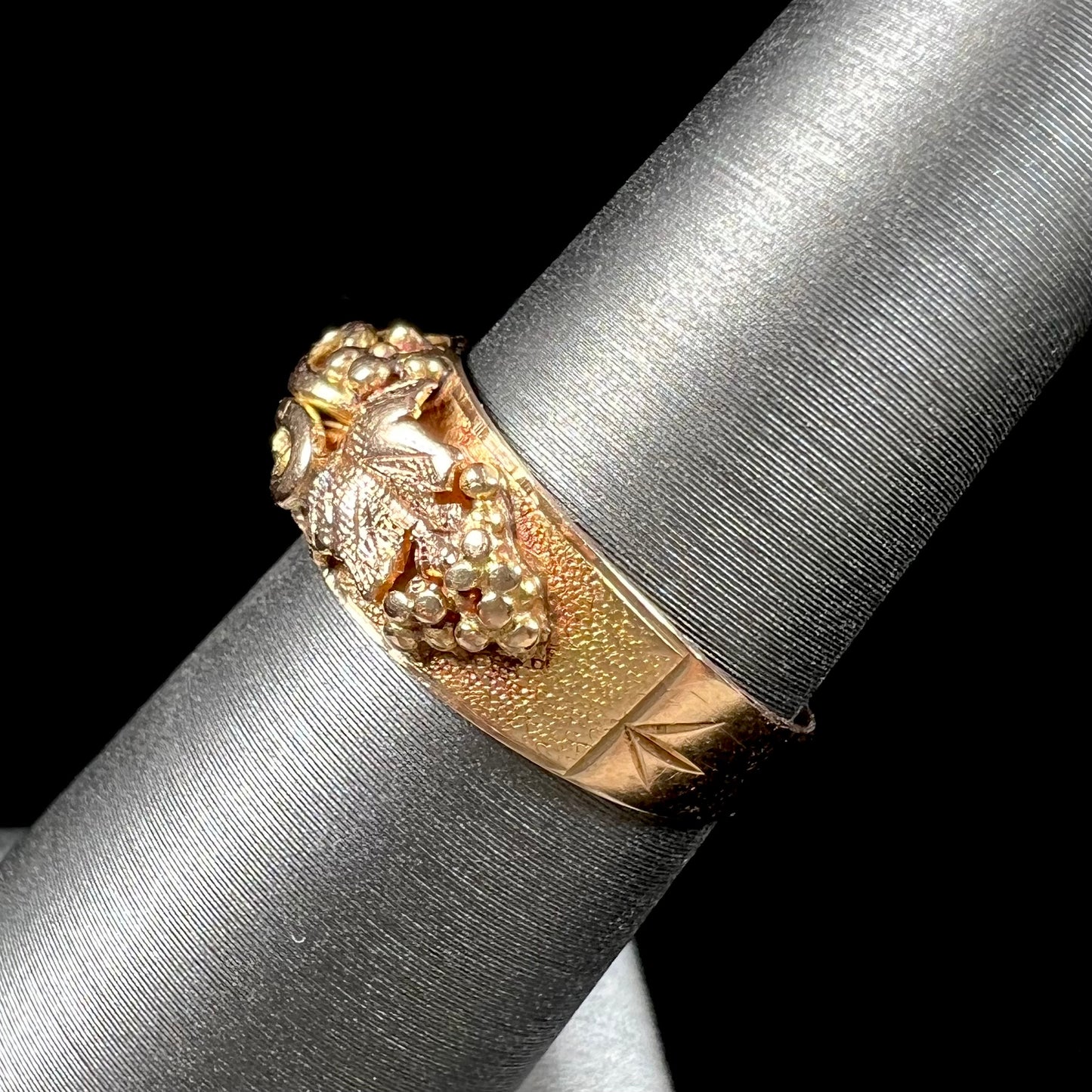 A ladies' two-tone Black Hills gold ring featuring the motif of leaves. The inside of the ring is stamped "16K" and "BARCLAY".