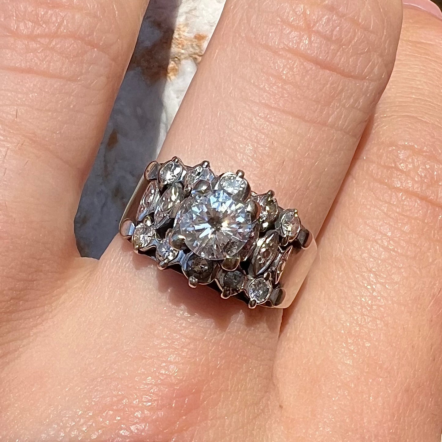 A vintage, 1940's style white gold diamond wedding ring set with a 0.68ct round diamond. The diamond has a noticeable black crystal inclusion.