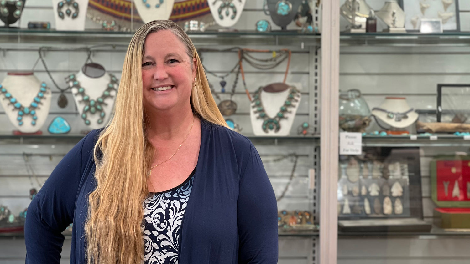 Jewelry designer, Carrie Burton Stanley, standing in her family's Anaheim gem and jewelry shop, Burton's Gems and Opals.