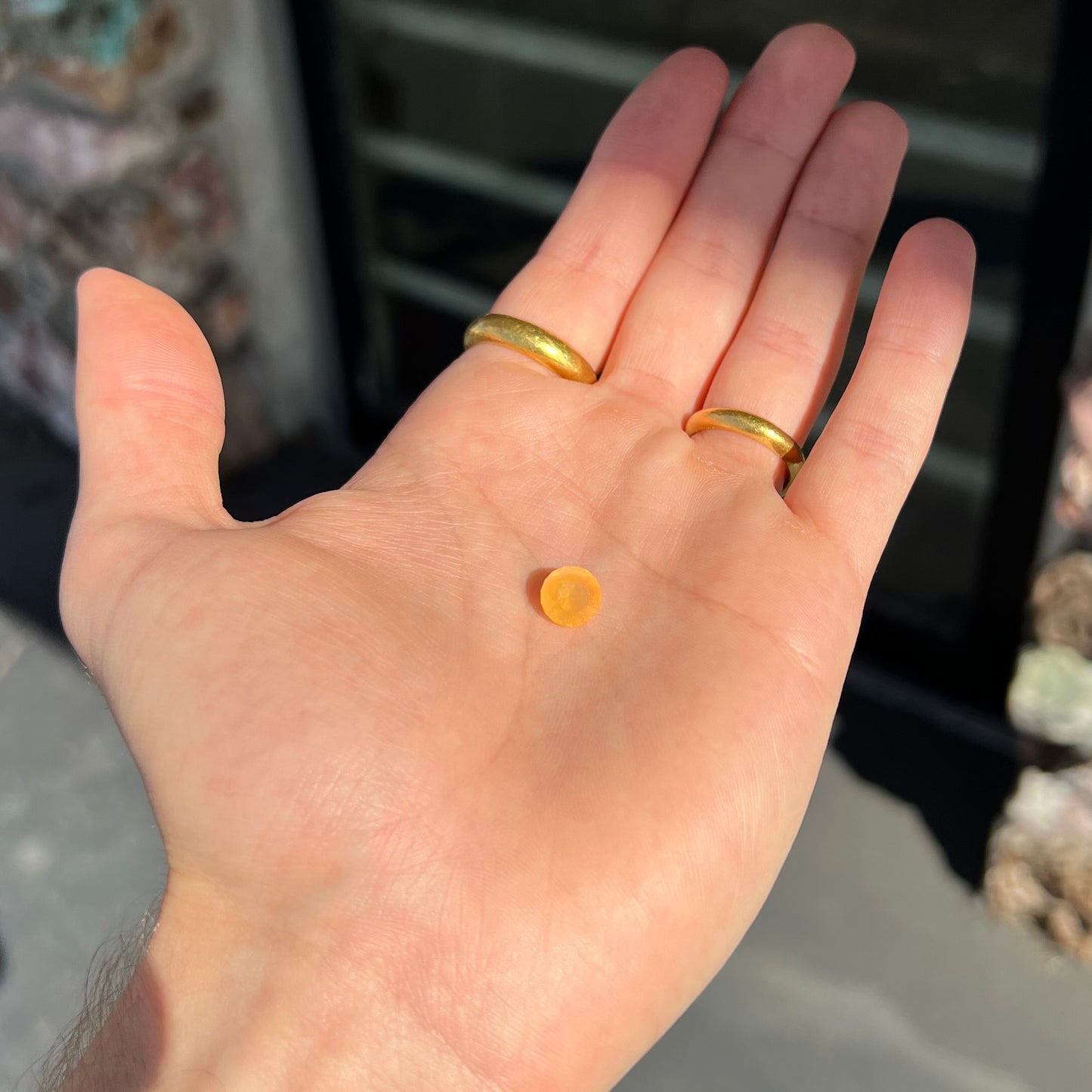 A loose, faceted round cut fire opal from Mexico. The stone is yellow orange in body color.