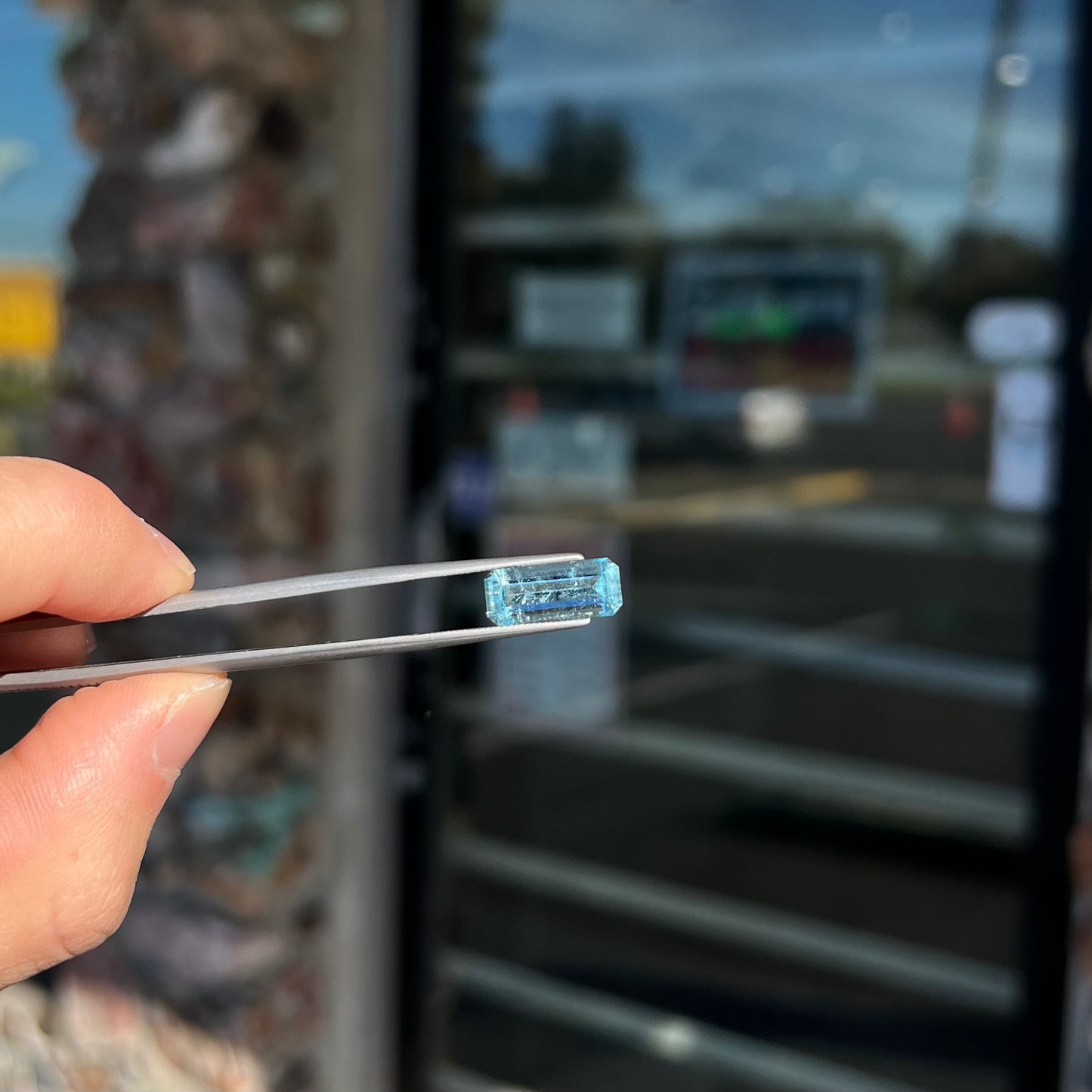 A loose, emerald cut aquamarine stone from Vietnam. The stone is an ice blue color.