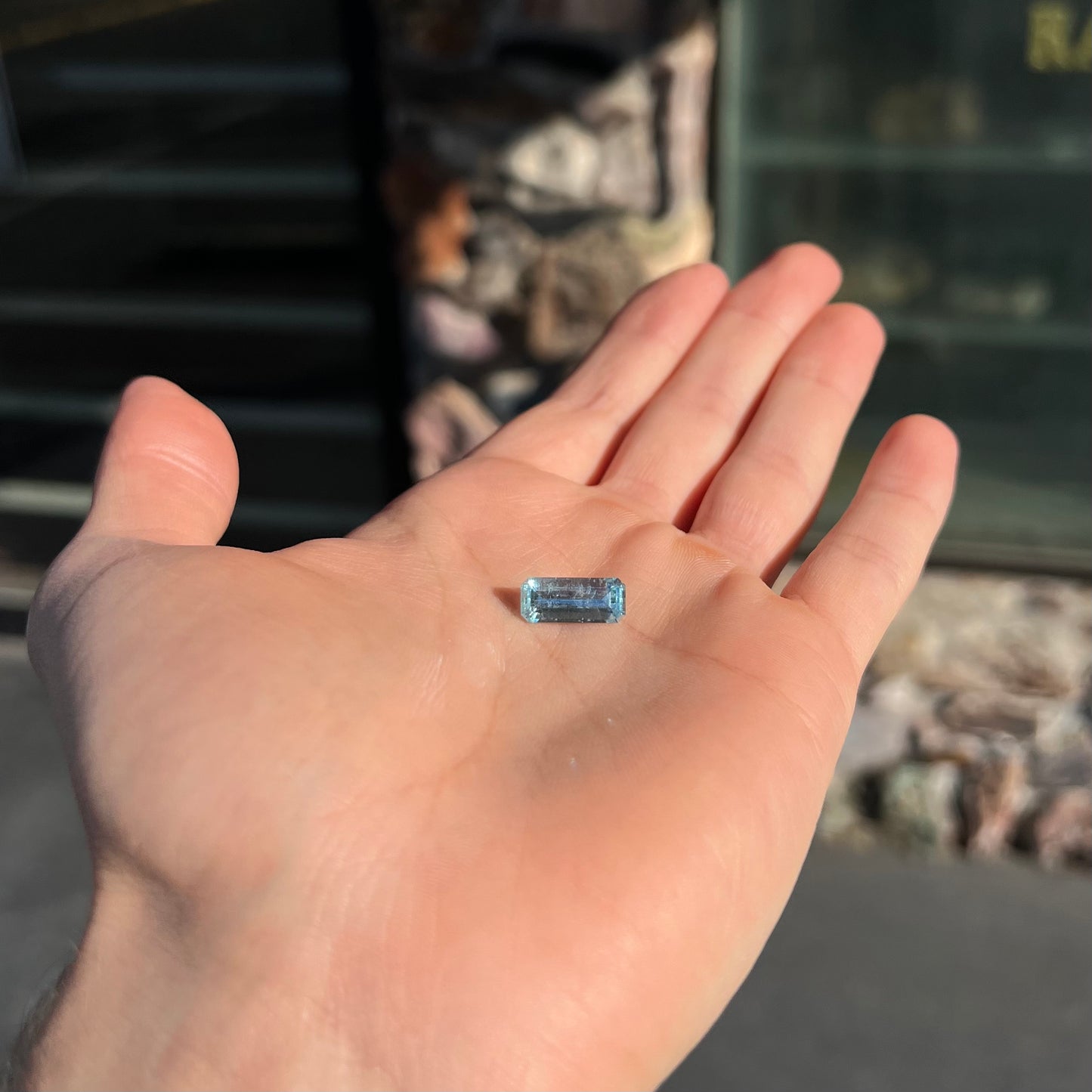 A loose, emerald cut aquamarine stone from Vietnam. The stone is an ice blue color.
