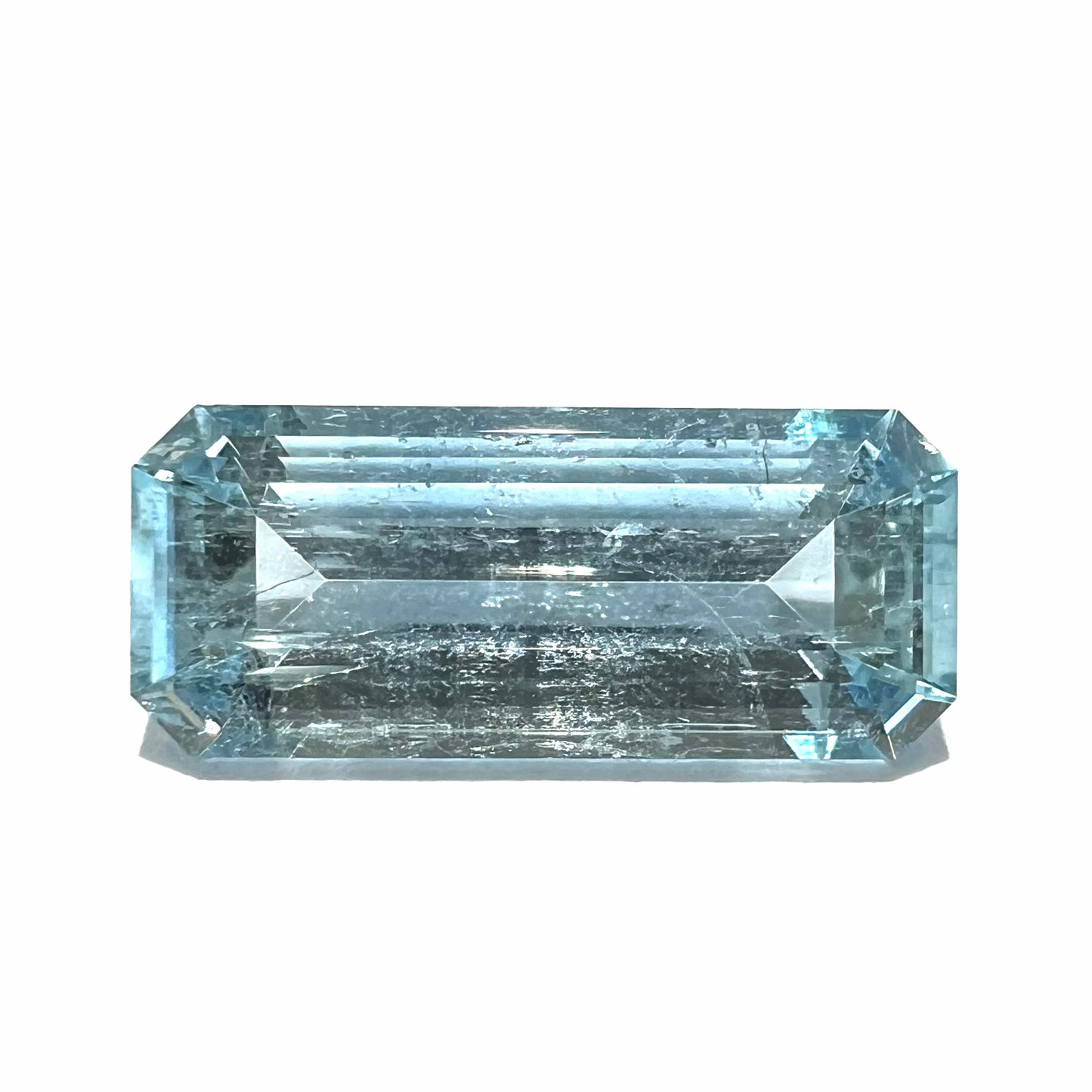 A loose, emerald cut aquamarine stone from Vietnam. The stone is an ice blue color.