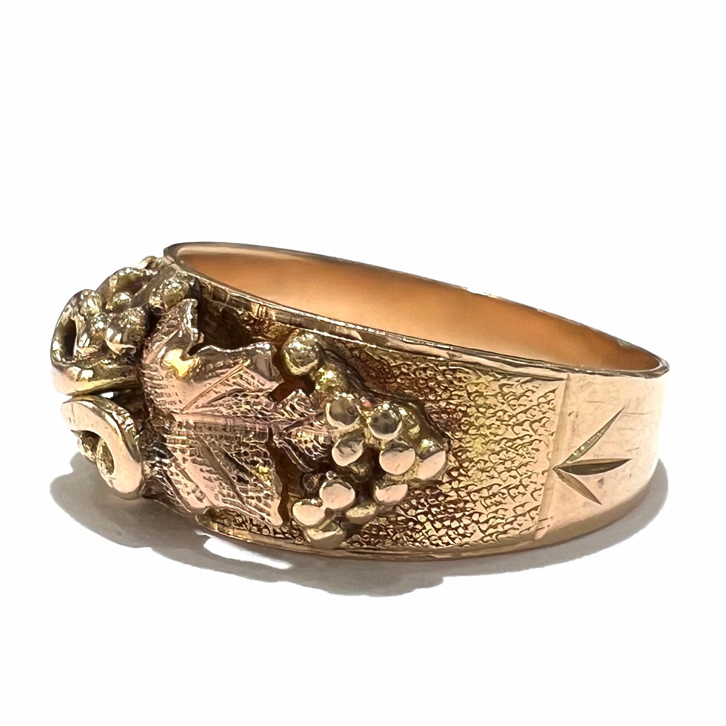 A ladies' two-tone Black Hills gold ring featuring the motif of leaves. The inside of the ring is stamped "16K" and "BARCLAY".