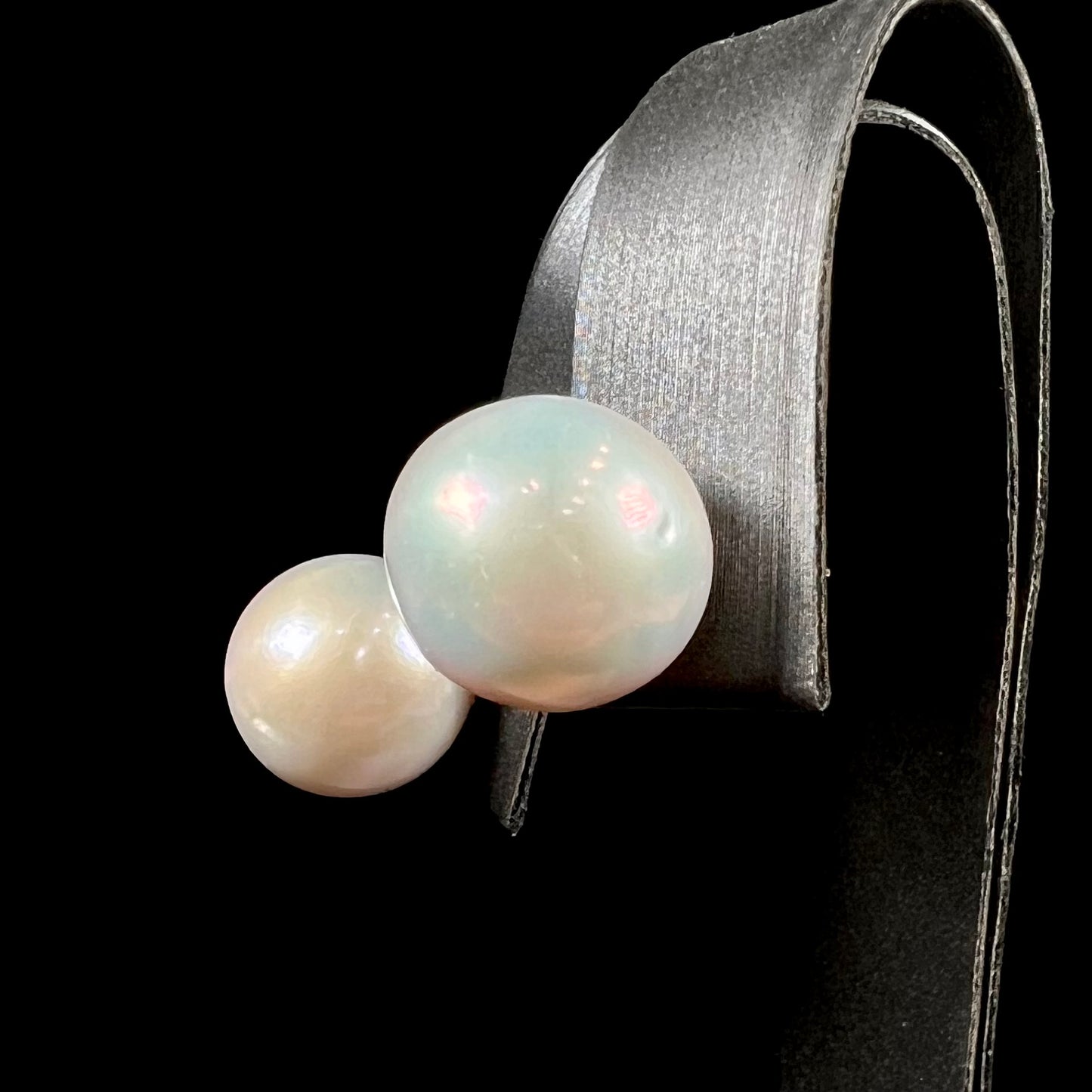 A pair of white South Seas pearl earrings with yellow gold push back friction posts.