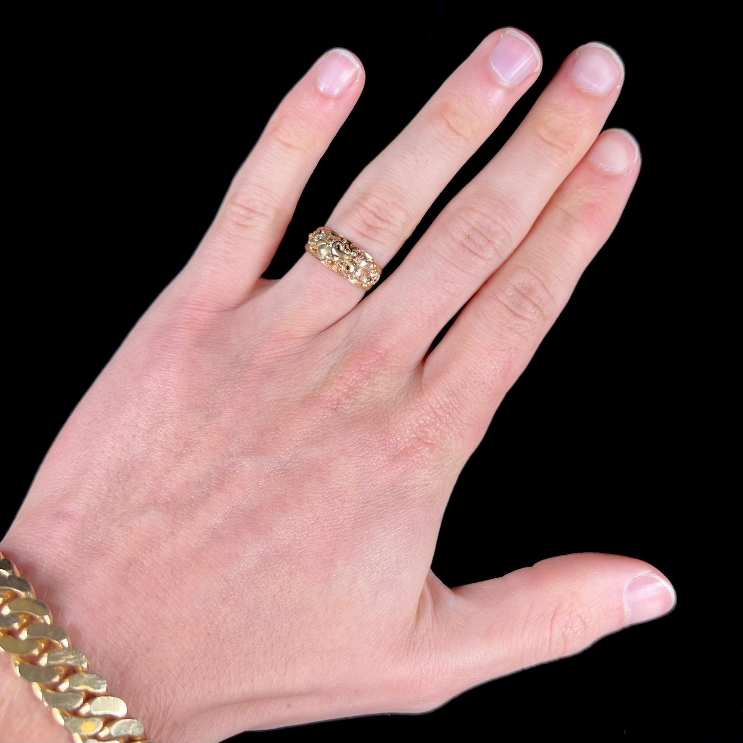 A ladies' two-tone Black Hills gold ring featuring the motif of leaves. The inside of the ring is stamped "16K" and "BARCLAY".