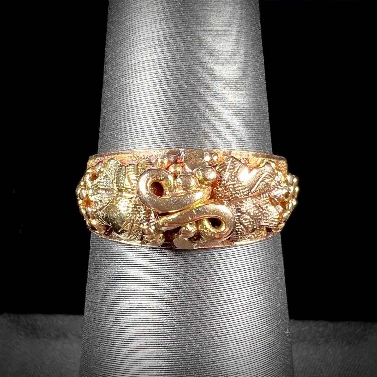 A ladies' two-tone Black Hills gold ring featuring the motif of leaves. The inside of the ring is stamped "16K" and "BARCLAY".
