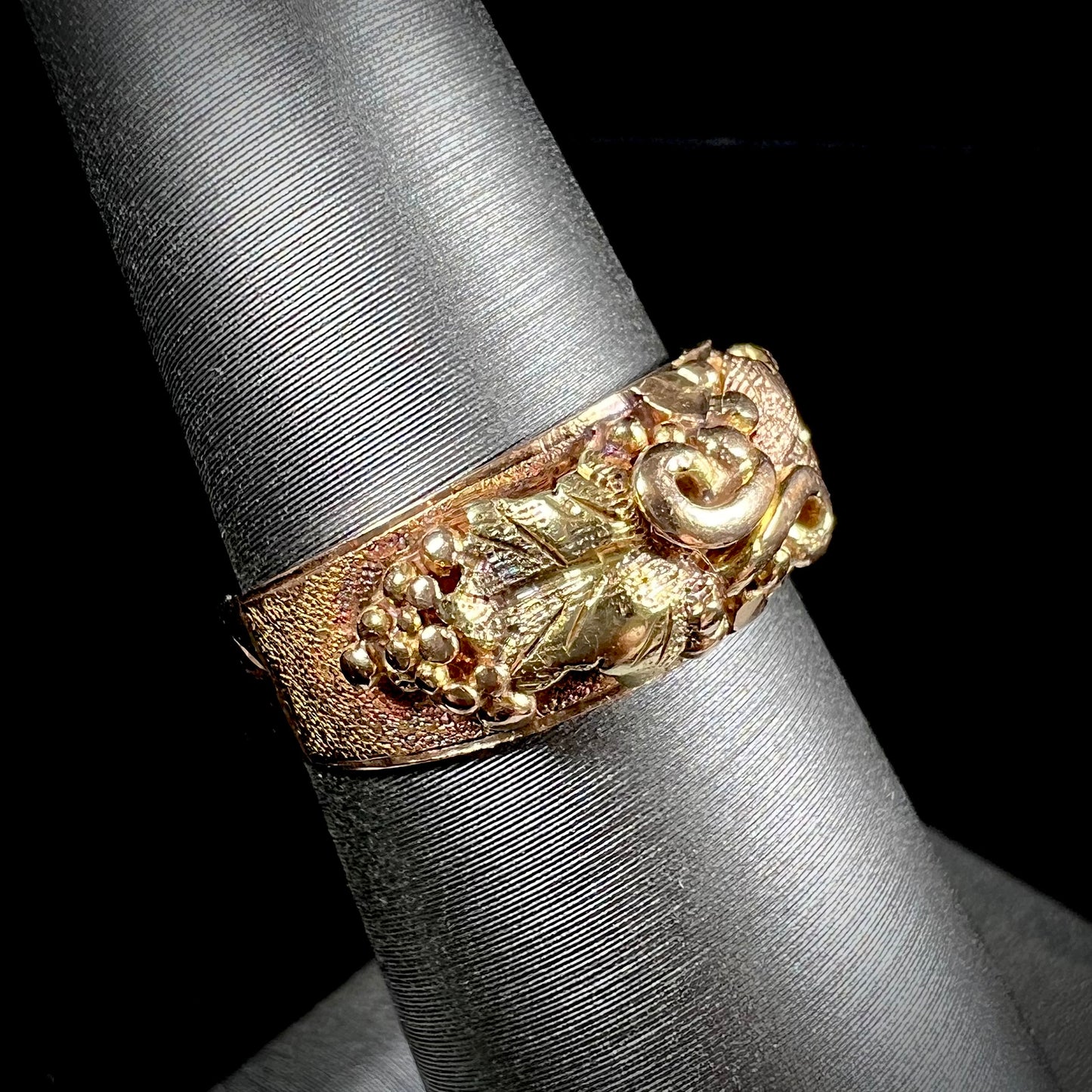 A ladies' two-tone Black Hills gold ring featuring the motif of leaves. The inside of the ring is stamped "16K" and "BARCLAY".