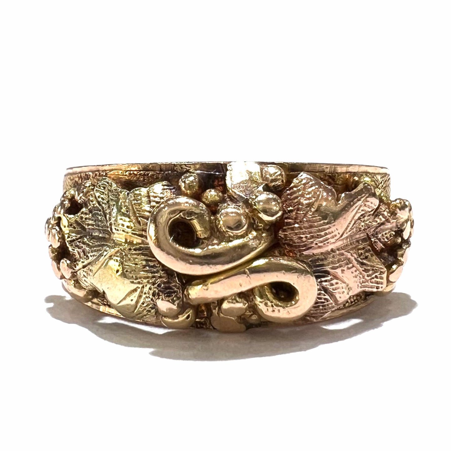 A ladies' two-tone Black Hills gold ring featuring the motif of leaves. The inside of the ring is stamped "16K" and "BARCLAY".