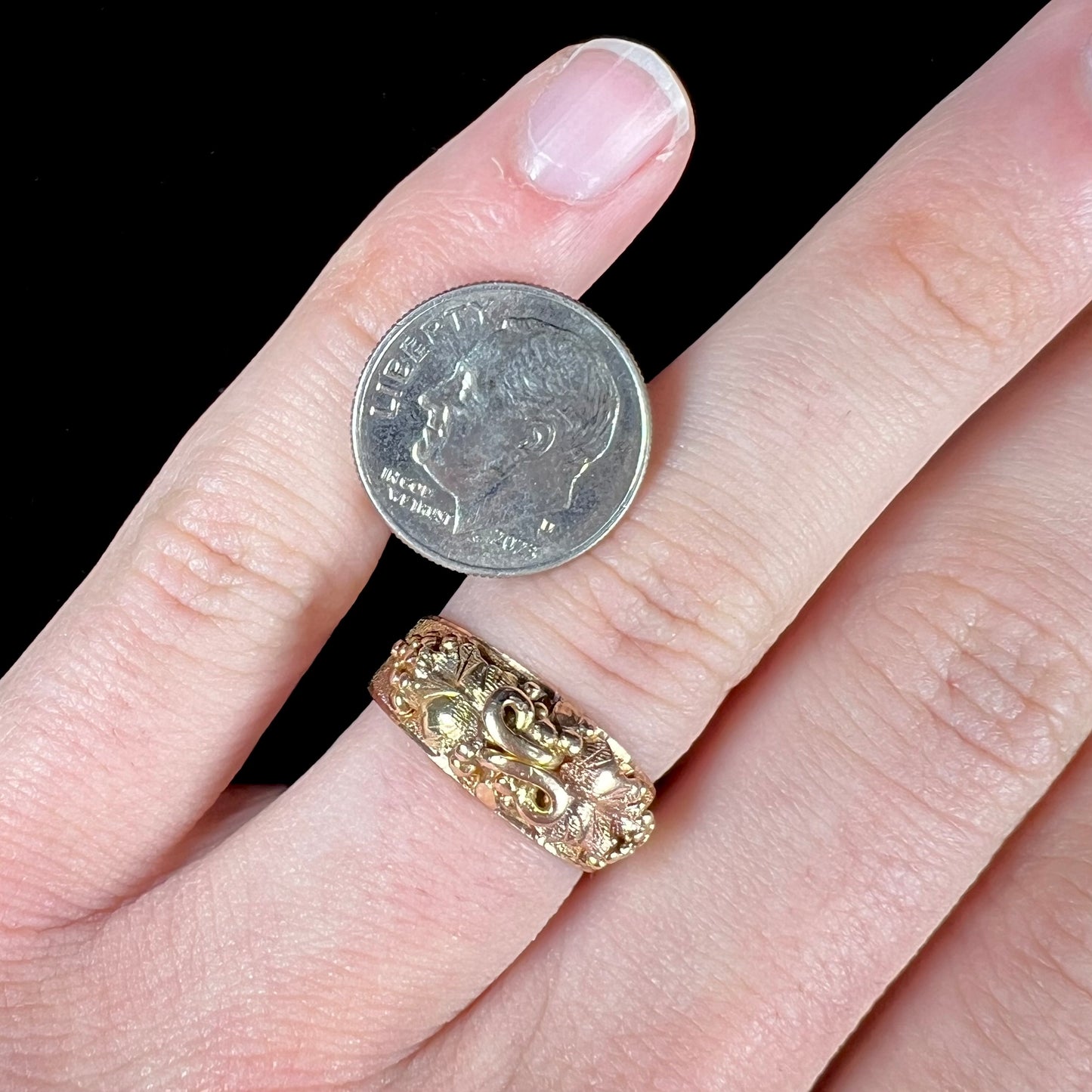 A ladies' two-tone Black Hills gold ring featuring the motif of leaves. The inside of the ring is stamped "16K" and "BARCLAY".