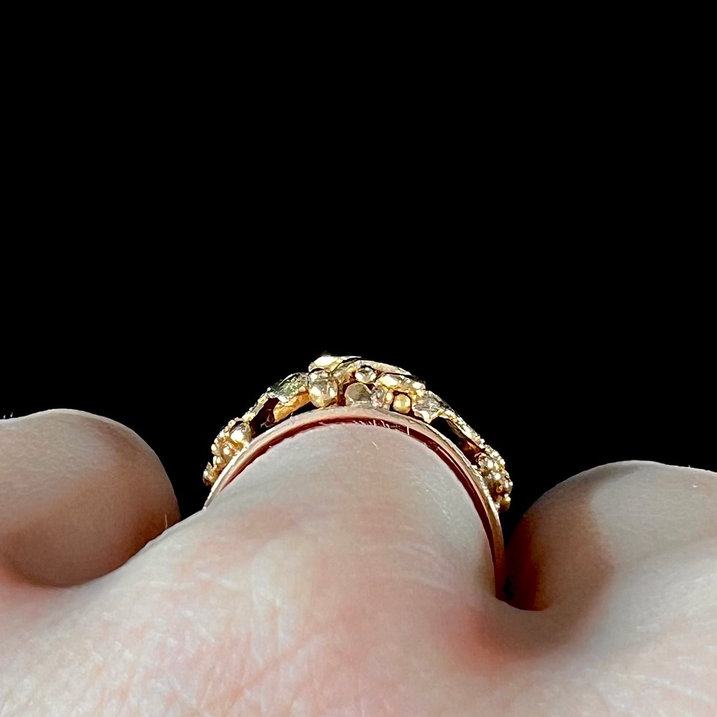 A ladies' two-tone Black Hills gold ring featuring the motif of leaves. The inside of the ring is stamped "16K" and "BARCLAY".
