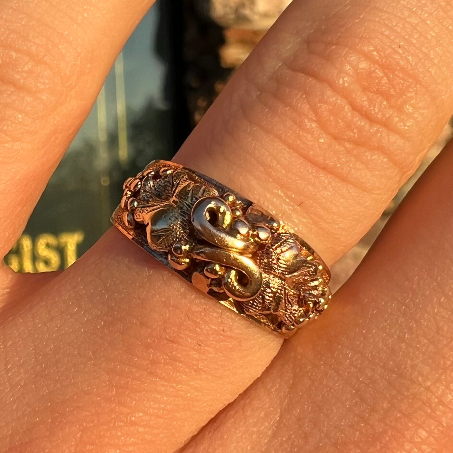 A ladies' two-tone Black Hills gold ring featuring the motif of leaves. The inside of the ring is stamped "16K" and "BARCLAY".