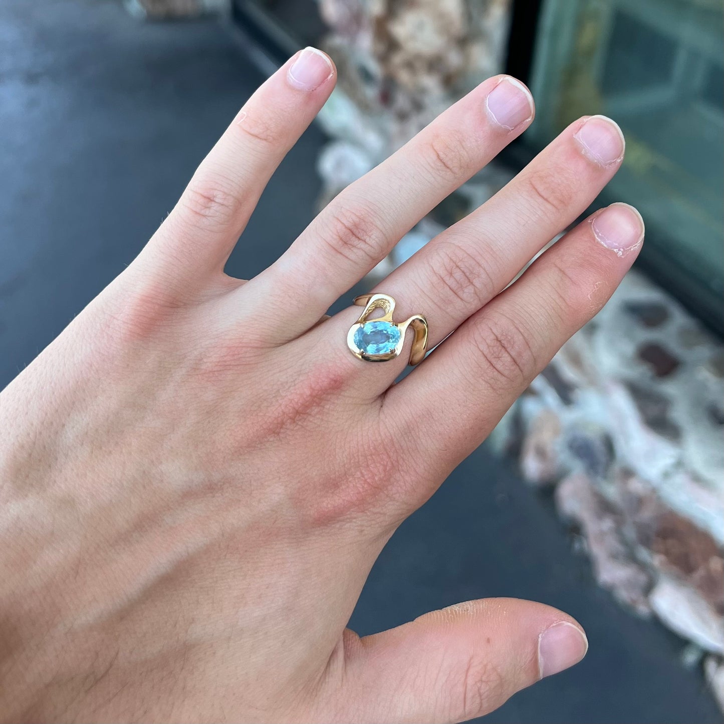 A ladies' estate yellow gold aquamarine solitaire ring. The aquamarine is oval cut.