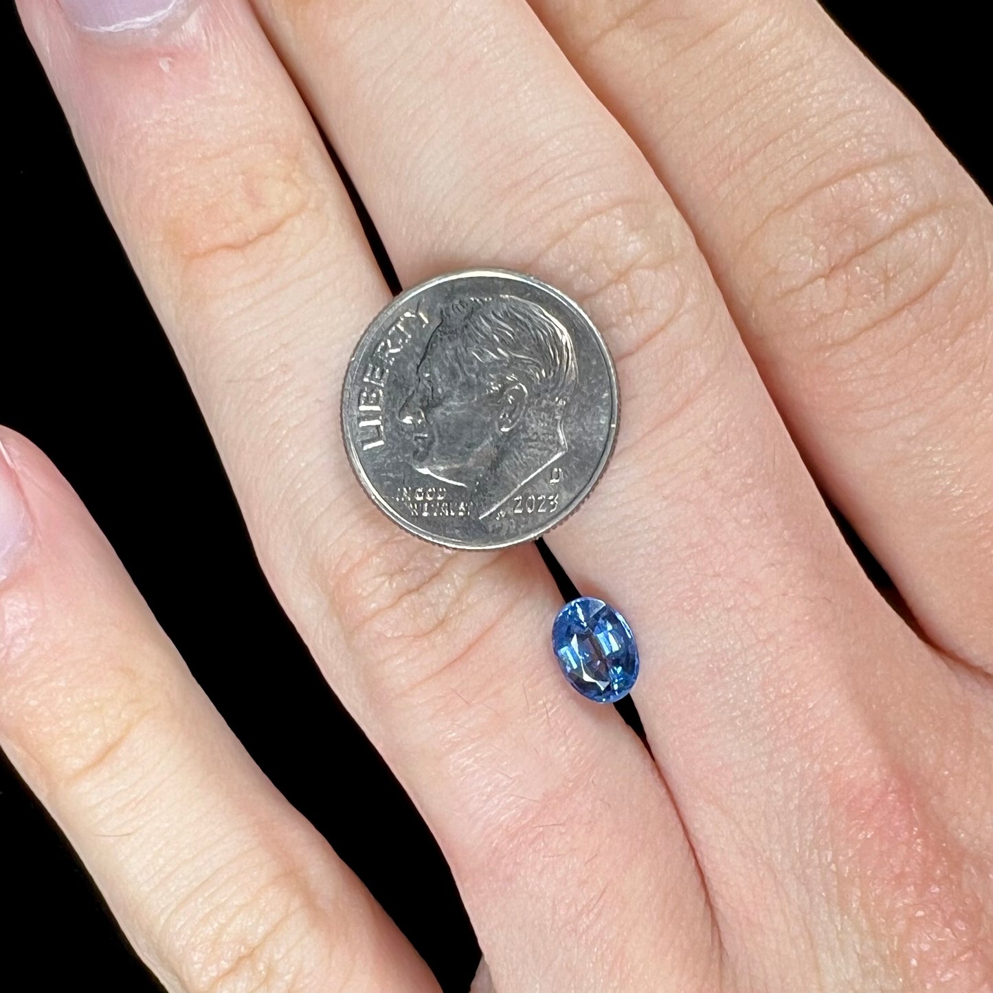 A loose, faceted oval cut blue kyanite gemstone.