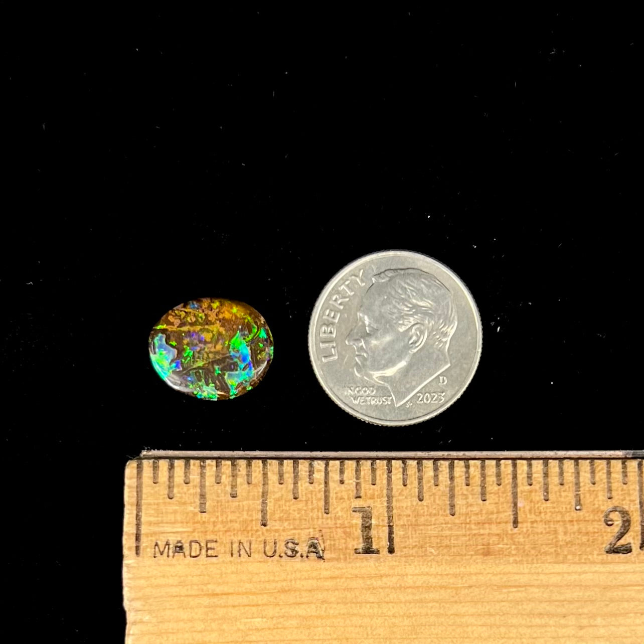 A bright green boulder opal stone from Koroit, Australia.