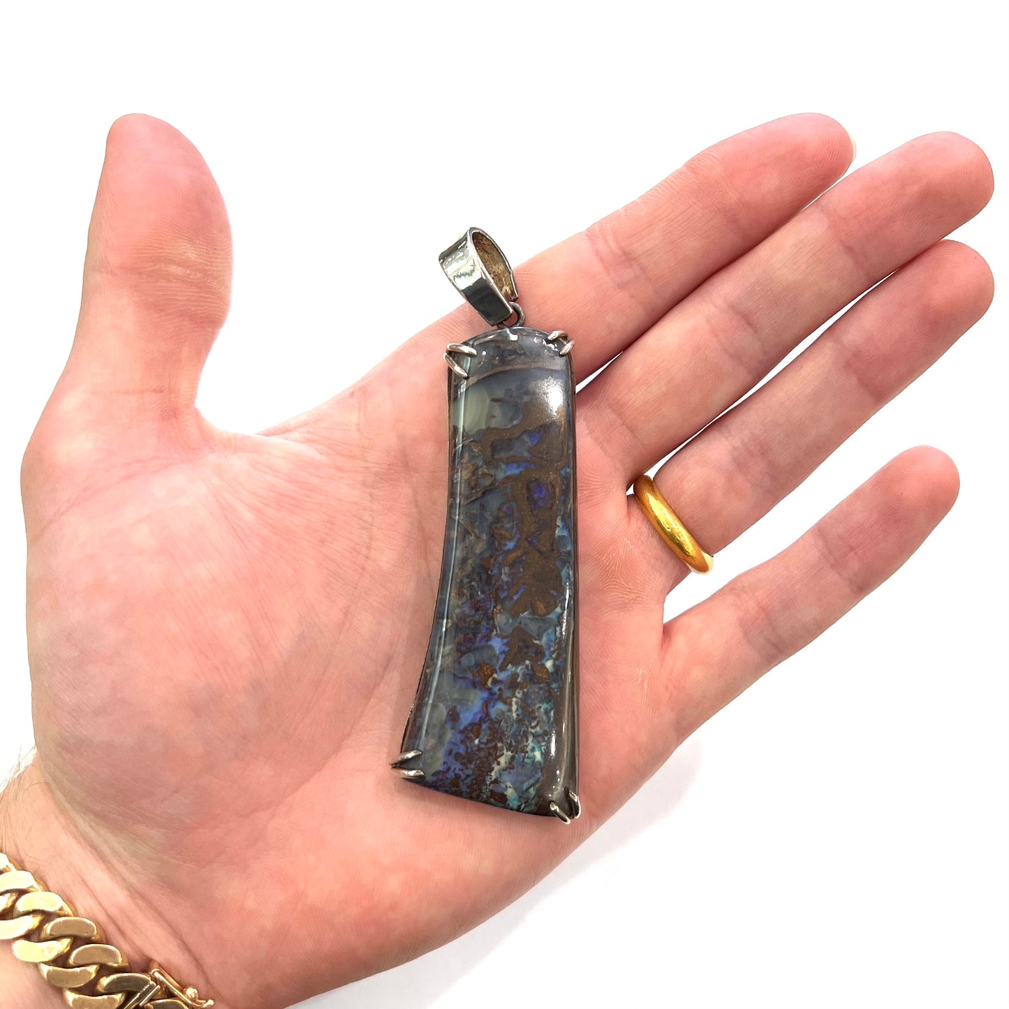 A men's sterling silver pendant set with a natural boulder opal from Quilpie, Australia.