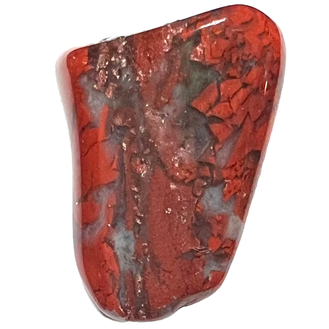 A tumbled red brecciated jasper stone.  The stone is opaque red with crackled transluscent agate quartz inclusions.