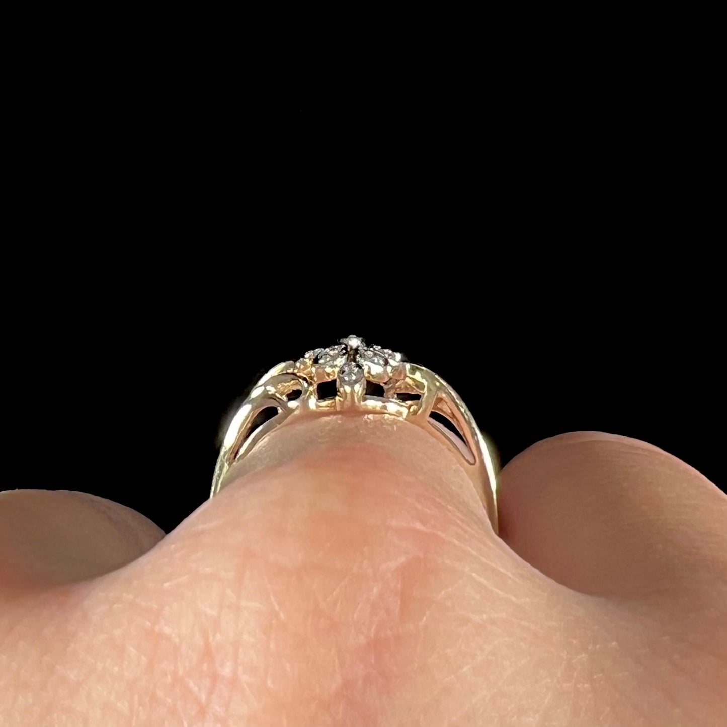 A ladies' vintage style gold diamond cluster ring.