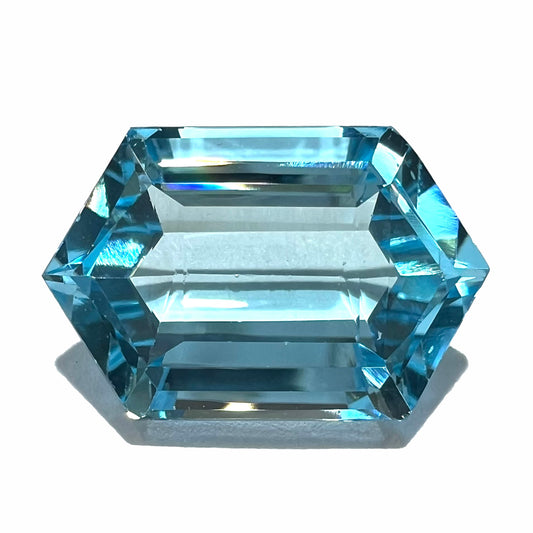 A loose, dutchess cut blue topaz gemstone.  The stone is a sky blue color.