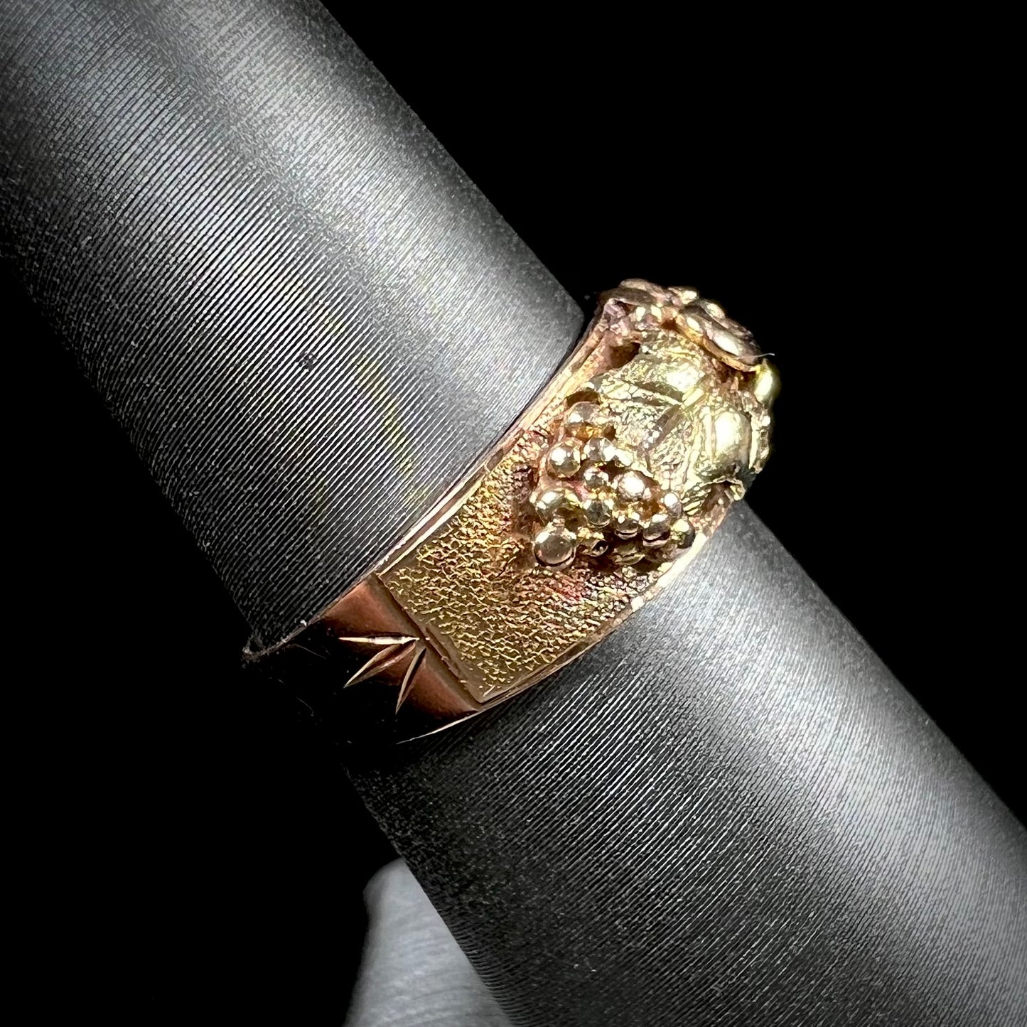 A ladies' two-tone Black Hills gold ring featuring the motif of leaves. The inside of the ring is stamped "16K" and "BARCLAY".