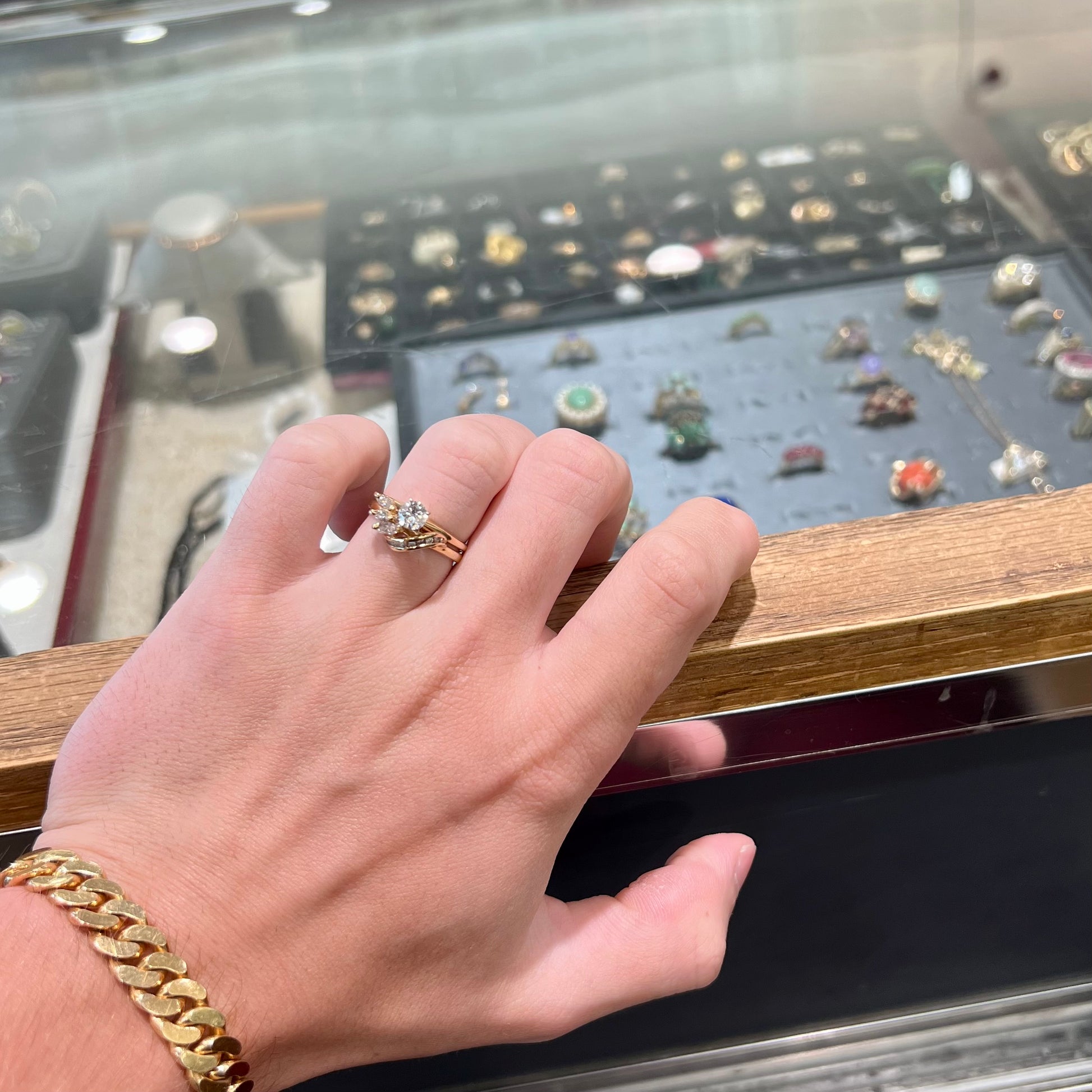 A vintage diamond wedding set with a round brilliant cut center stone and marquise cut accents in yellow gold.