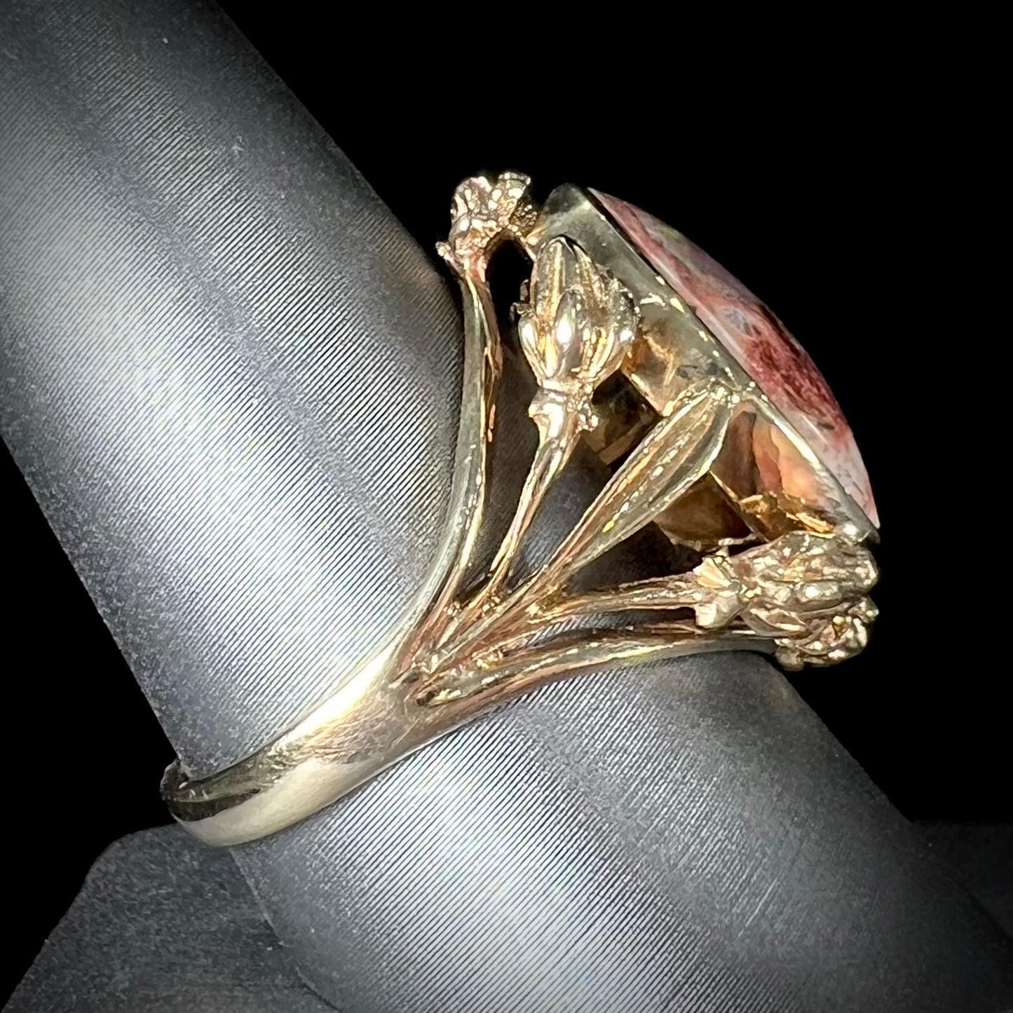 A ladies' estate yellow gold solitaire ring set with an oval cabochon cut natural Cantera fire opal.