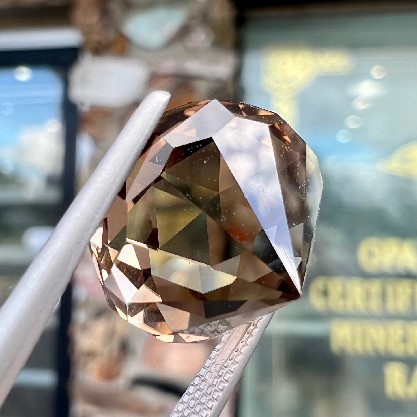 A loose, modified brilliant Portuguese cut smoky quartz gemstone.