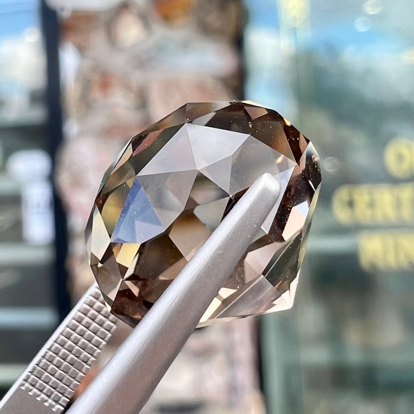 A loose, modified brilliant Portuguese cut smoky quartz gemstone.