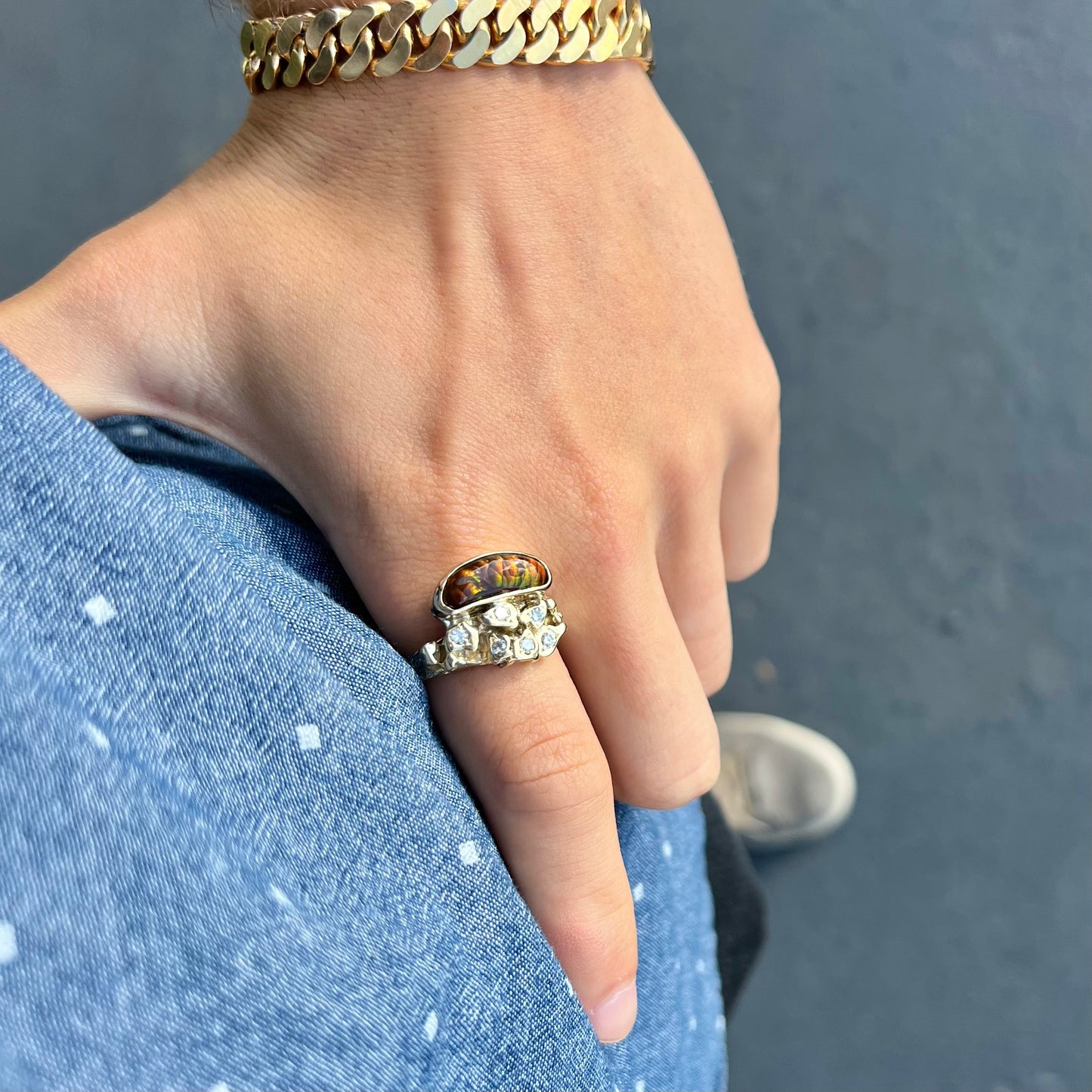 A ladies' nugget style yellow gold Mexican fire agate and diamond ring.