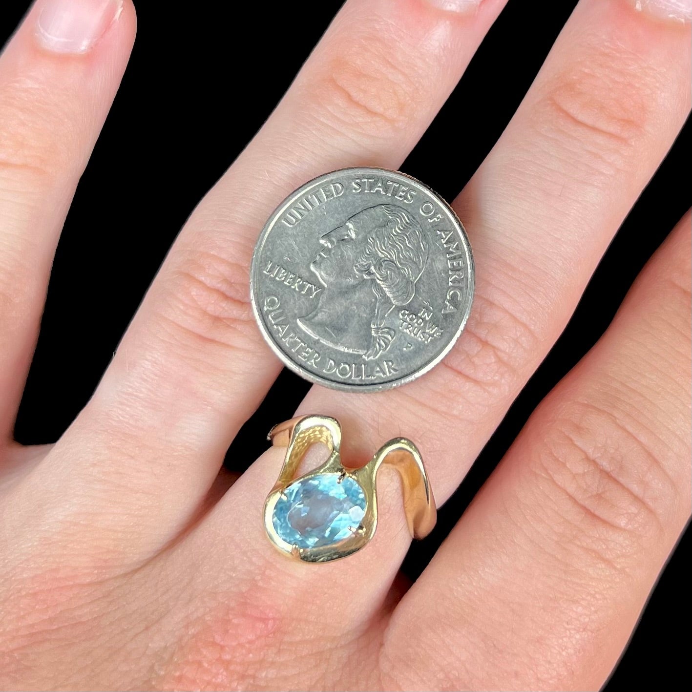 A ladies' estate yellow gold aquamarine solitaire ring. The aquamarine is oval cut.