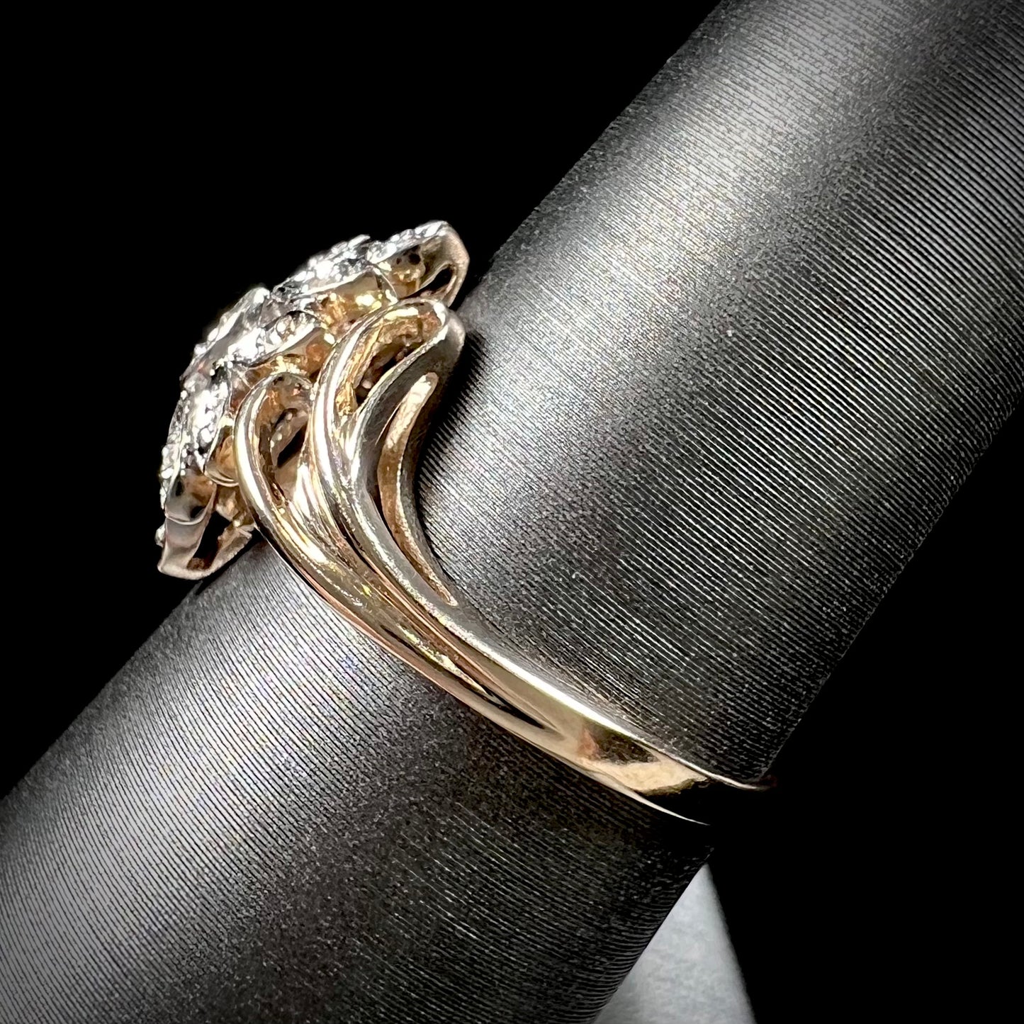 A ladies' vintage style gold diamond cluster ring.