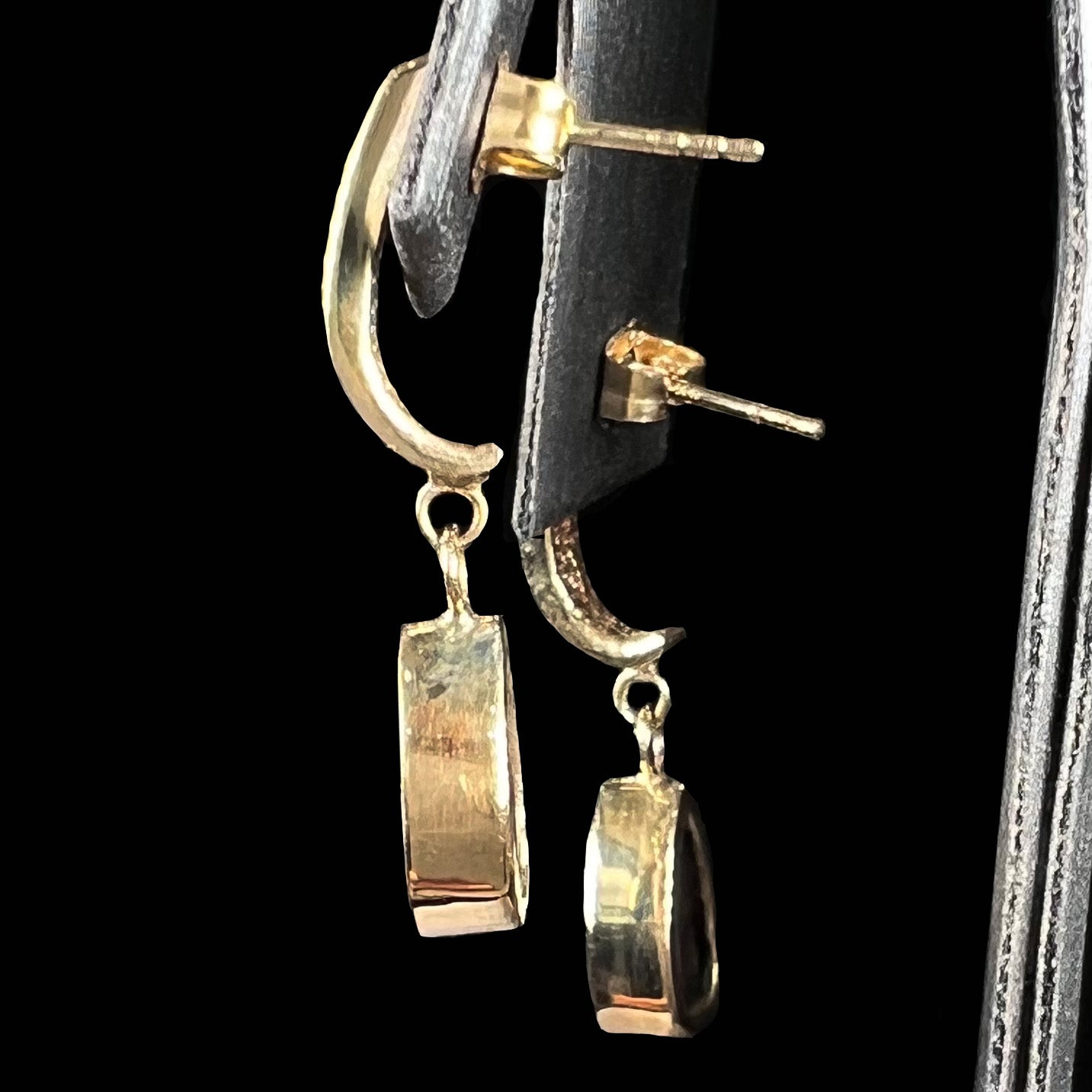A pair of yellow gold dangle earrings set with natural pear shaped boulder opals and diamonds.