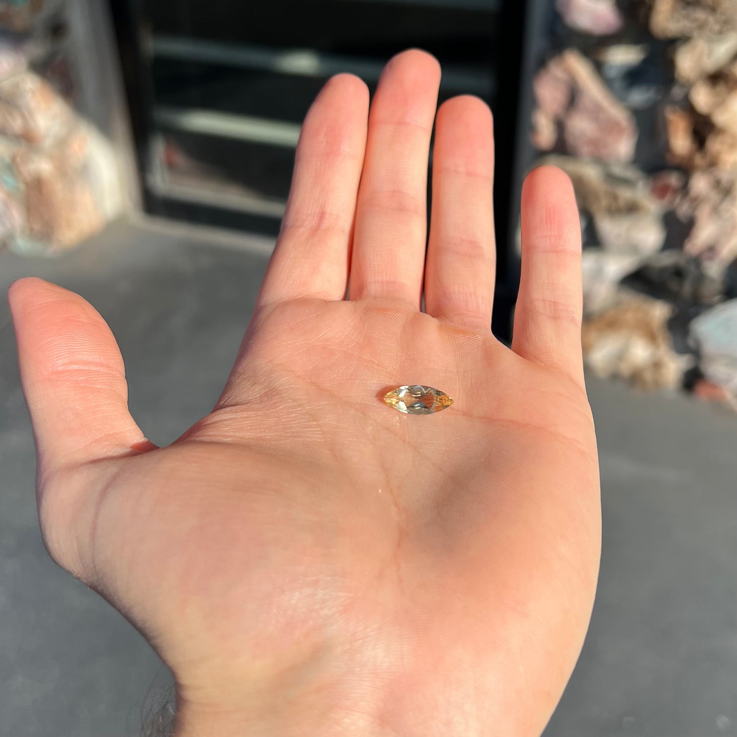 A loose, marquise cut golden beryl gemstone. The stone is a light yellow color.