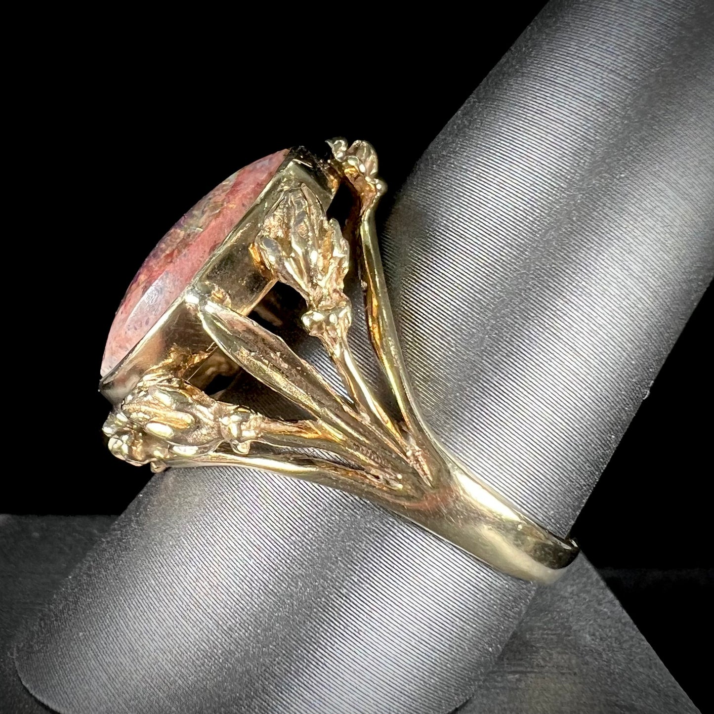 A ladies' estate yellow gold solitaire ring set with an oval cabochon cut natural Cantera fire opal.