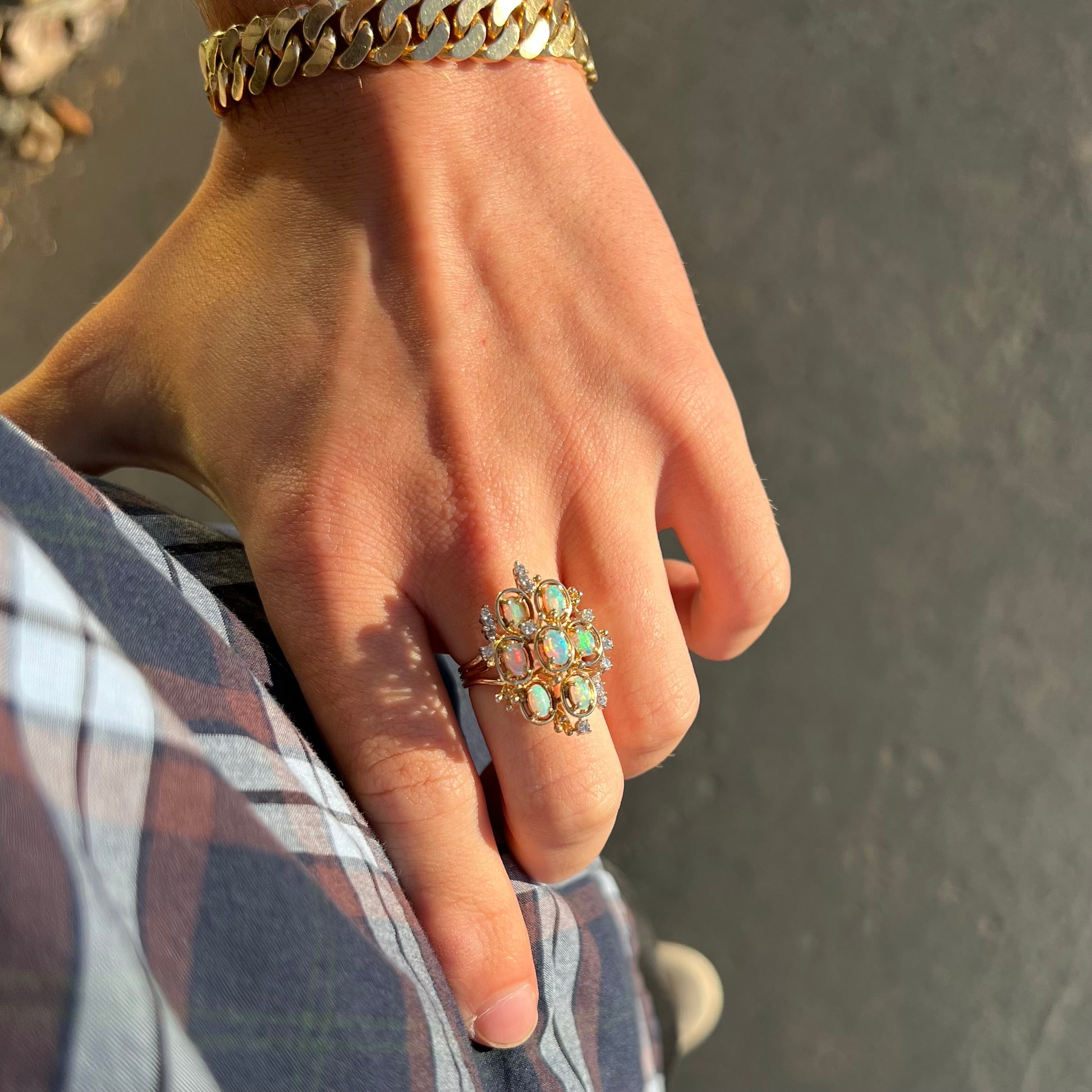 A ladies' vintage mid-century modern style opal and diamond cluster ring in yellow gold.