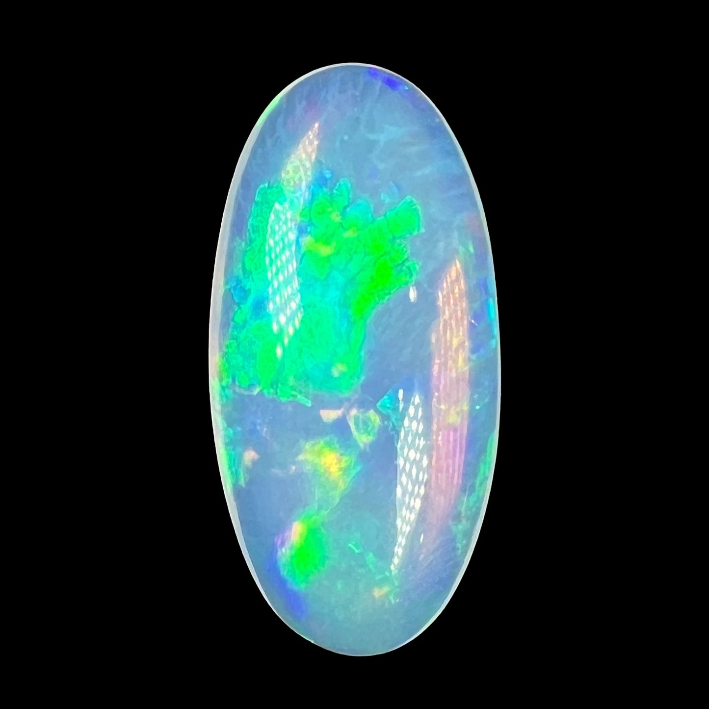 An oval shaped Ethiopian opal with green fire.