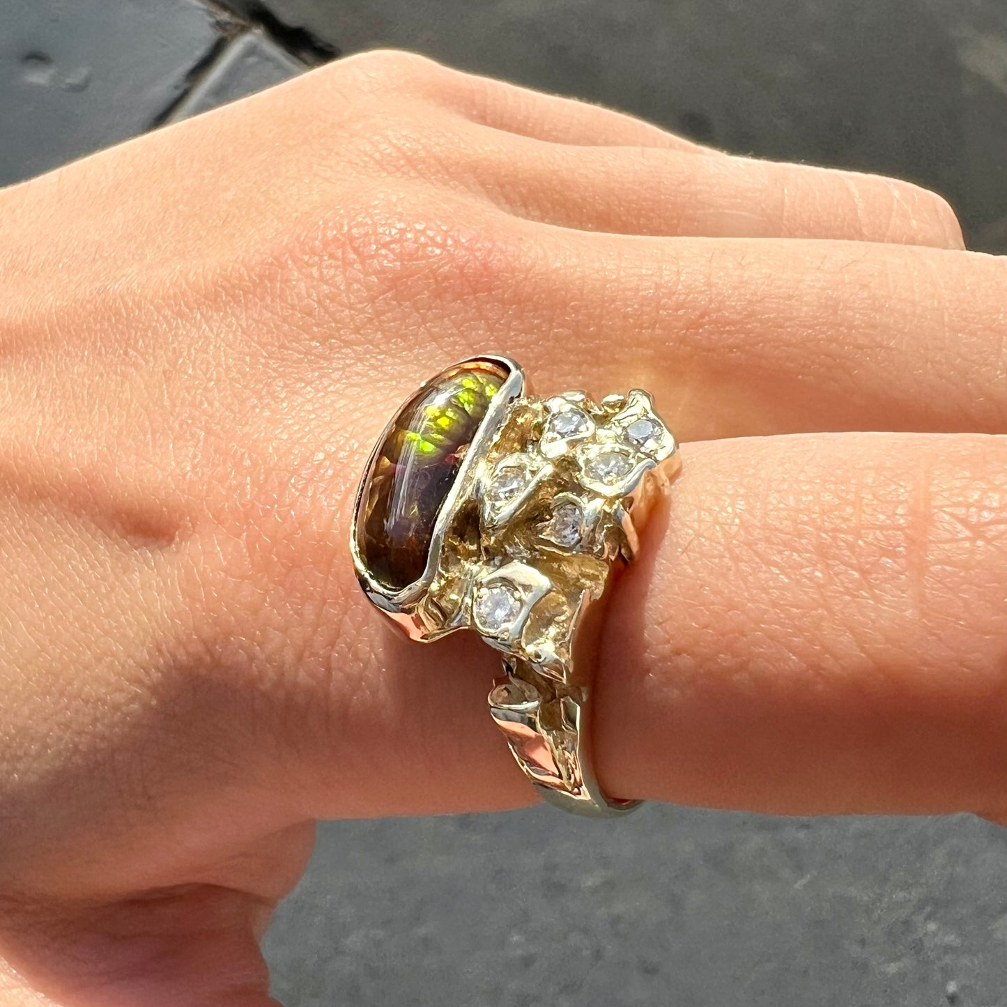 A ladies' nugget style yellow gold Mexican fire agate and diamond ring.