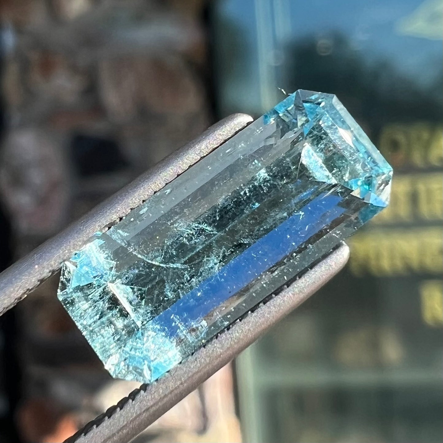 A loose, emerald cut aquamarine stone from Vietnam. The stone is an ice blue color.