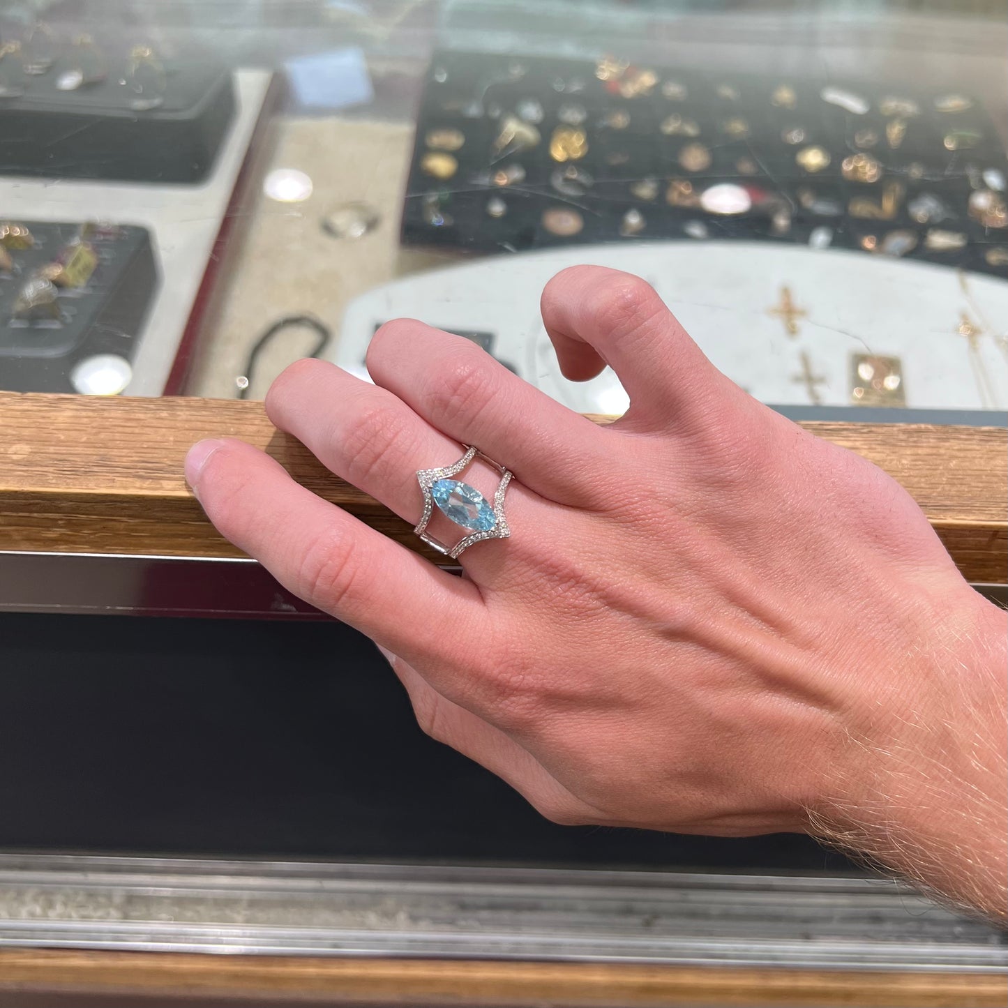 A ladies' marquise cut blue topaz and cubic zirconia accented ring cast in sterling silver.