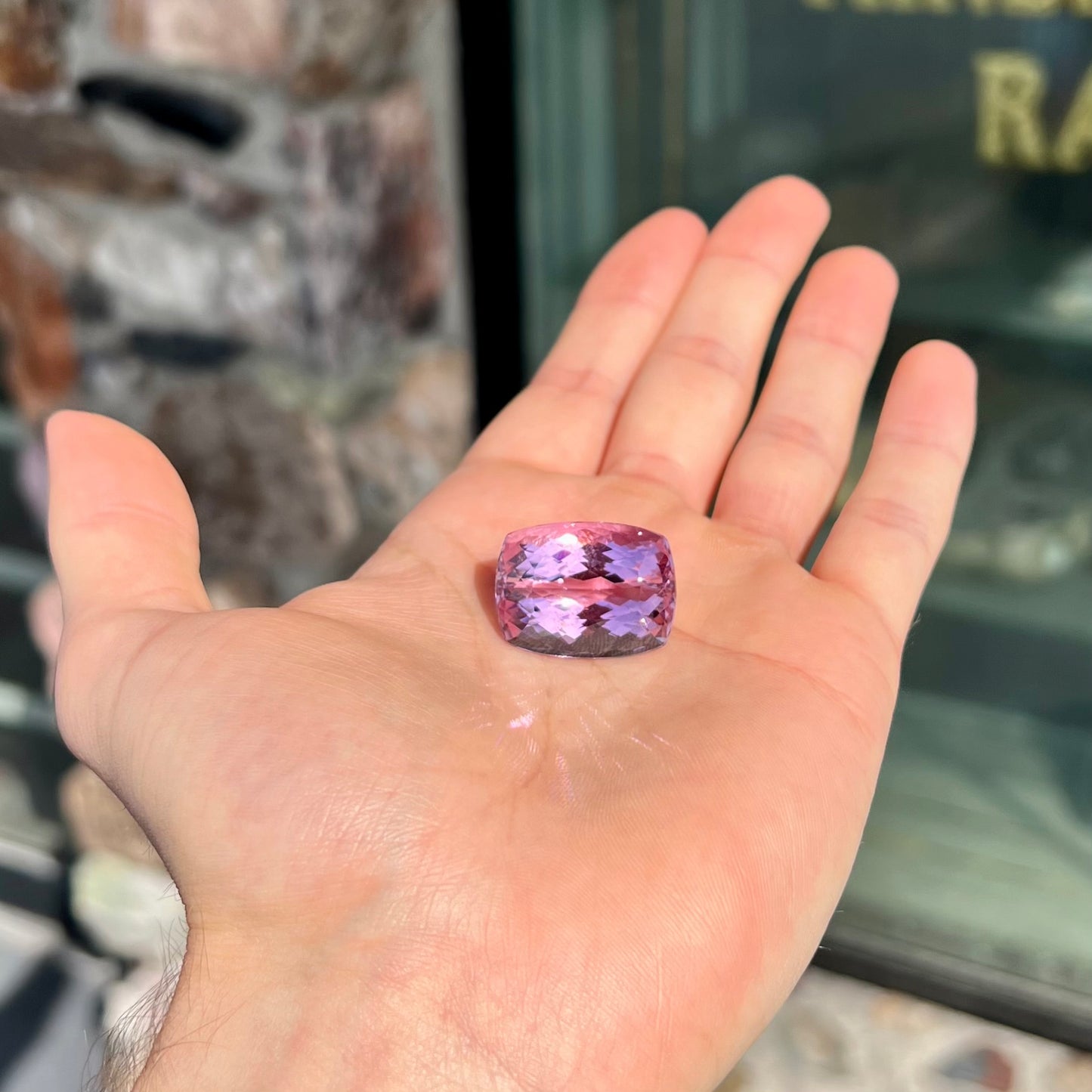 A modified cushion cut Afghanistan kunzite gemstone. The stone is a purplish pink color and weighs 49.30 carats.