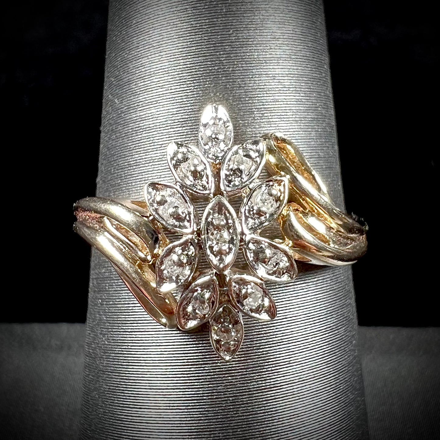 A ladies' vintage style gold diamond cluster ring.