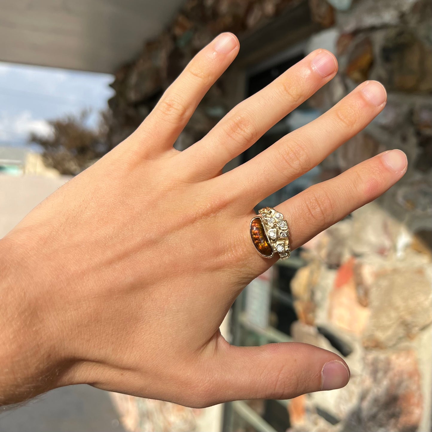 A ladies' nugget style yellow gold Mexican fire agate and diamond ring.