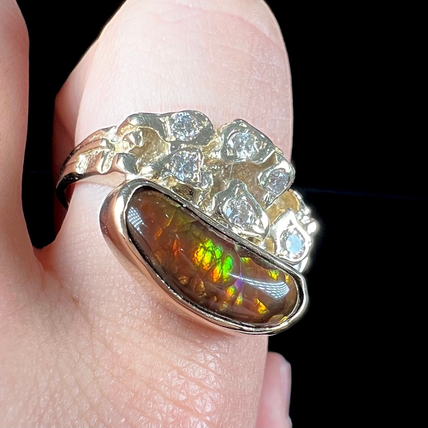 A ladies' nugget style yellow gold Mexican fire agate and diamond ring.