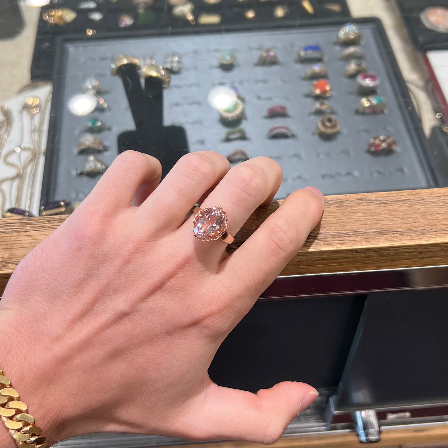 A ladies' rose gold solitaire ring set with an oval cut pink morganite gemstone.