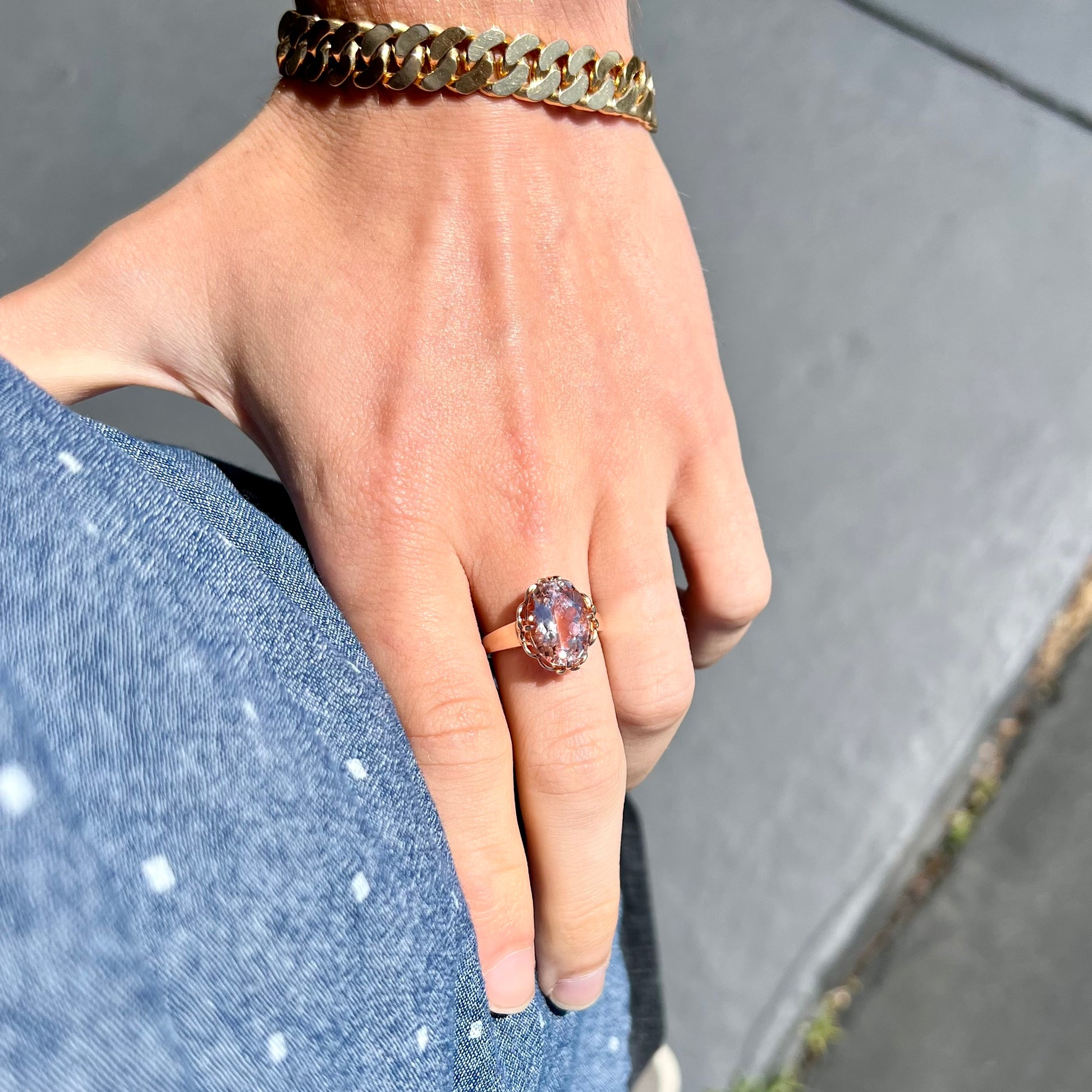 A ladies' rose gold solitaire ring set with an oval cut pink morganite gemstone.