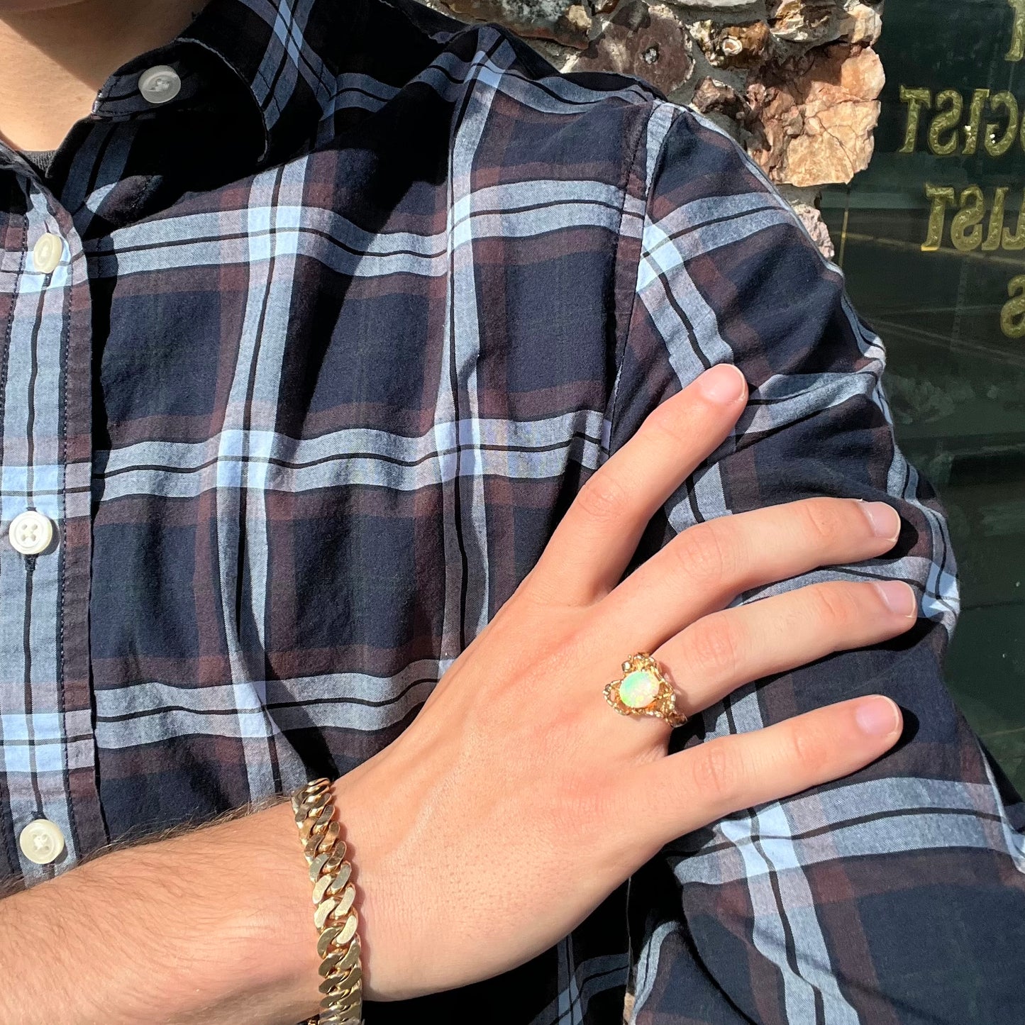 A ladies' organic style yellow gold ring prong set with a natural, green Australian crystal opal.