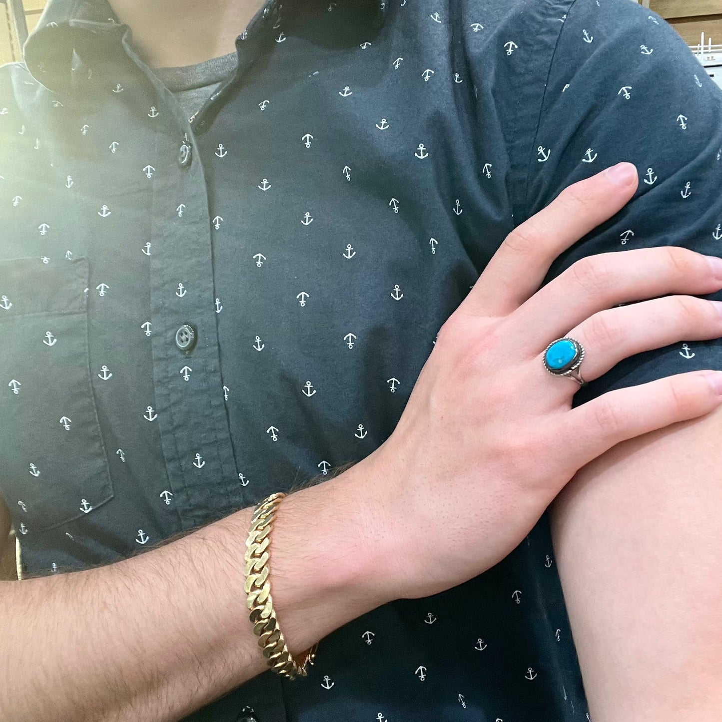 A vintage ladies' Pilot Mountain turquoise ring handmade in sterling silver with a rope accented bezel.