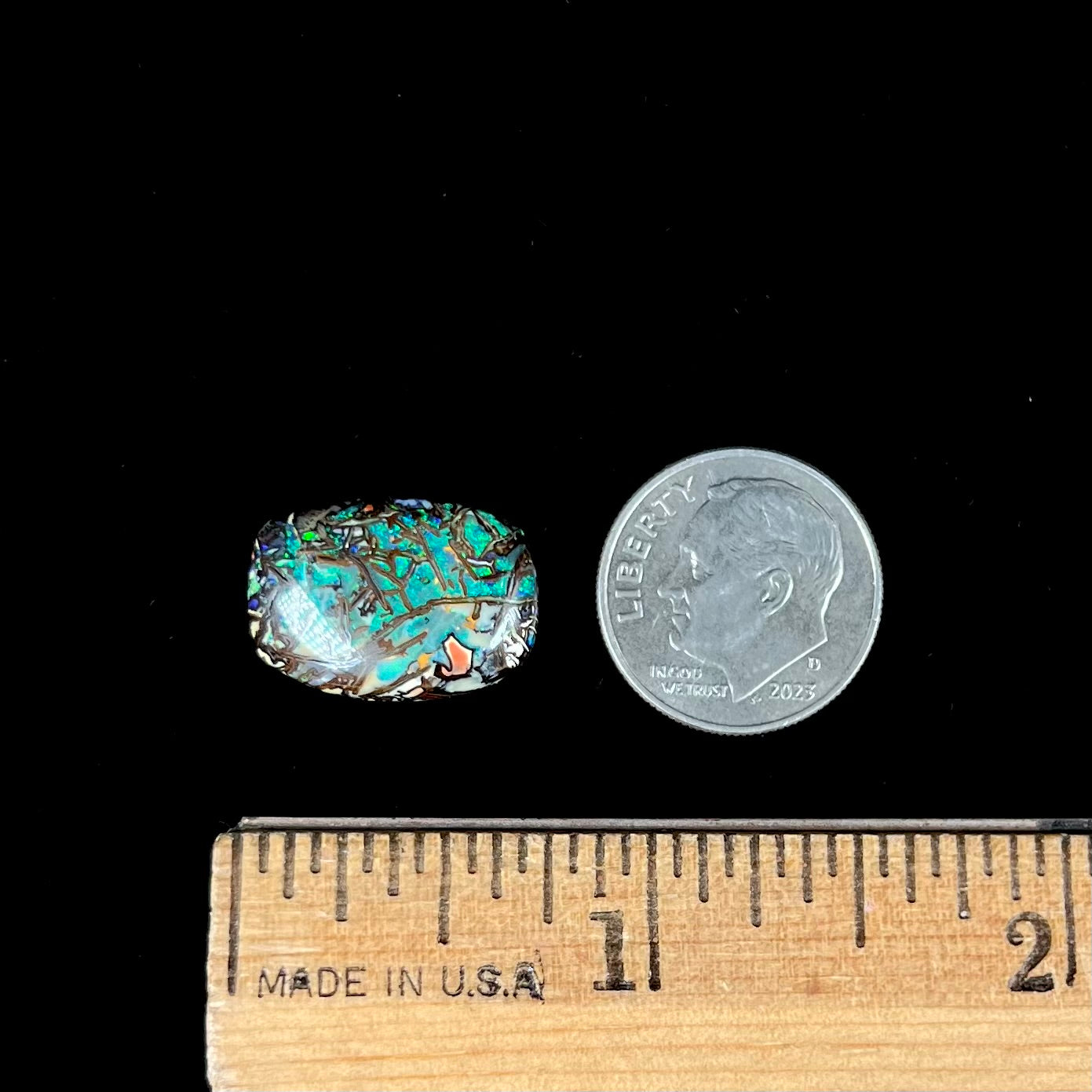 A barrel shaped boulder matrix opal from Koroit, Australia. The opal has blue fire.