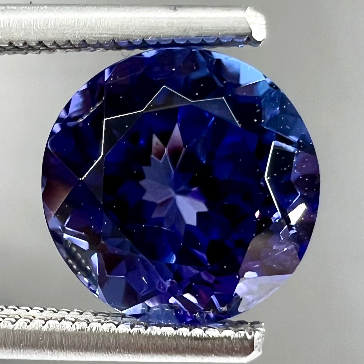 A loose, AAA grade, deep blue, round brilliant cut tanzanite stone.